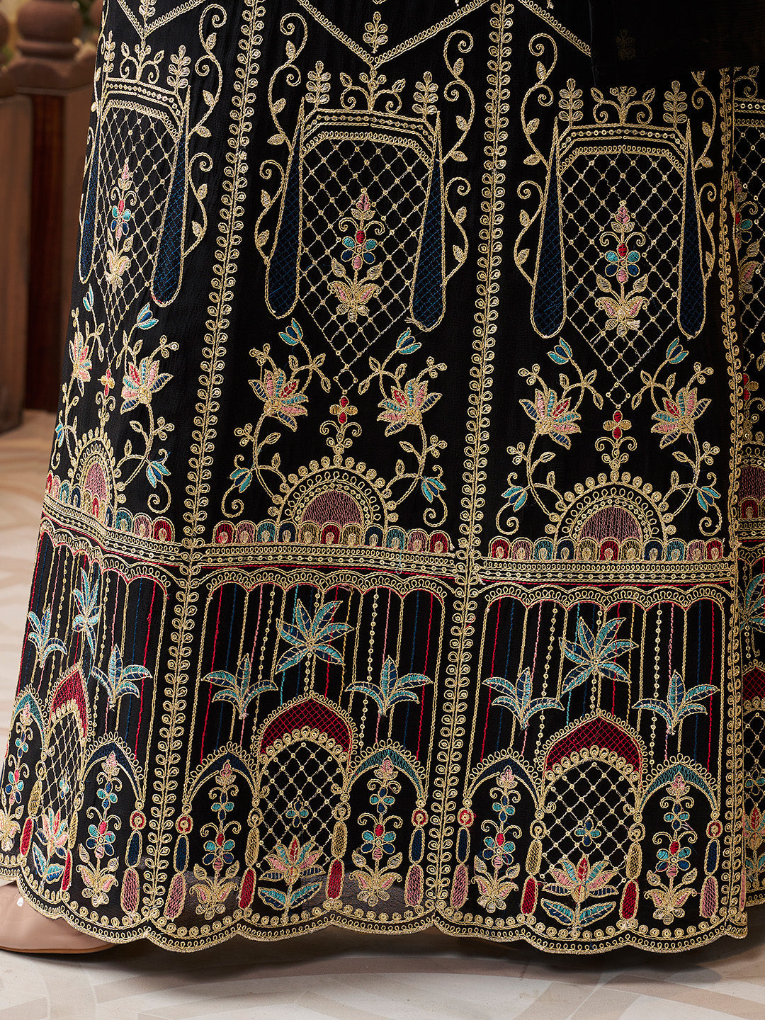 Festive black sharara suit with scalloped hem and multicolor detailing
