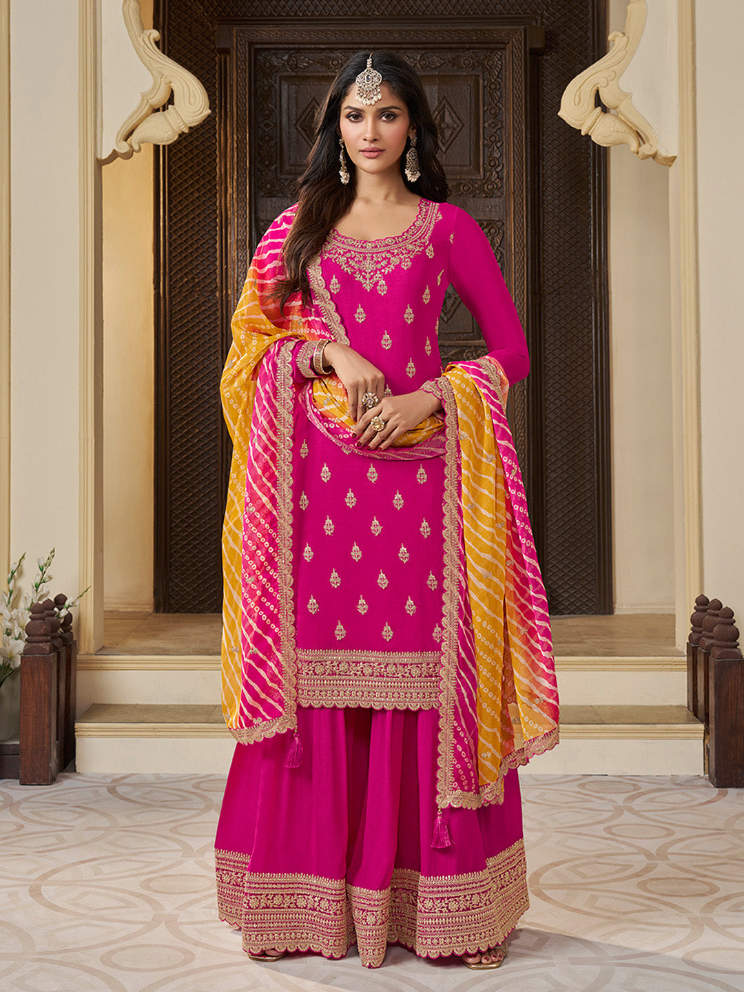 Rani pink sharara suit with sequin embroidery and Bandhani dupatta
