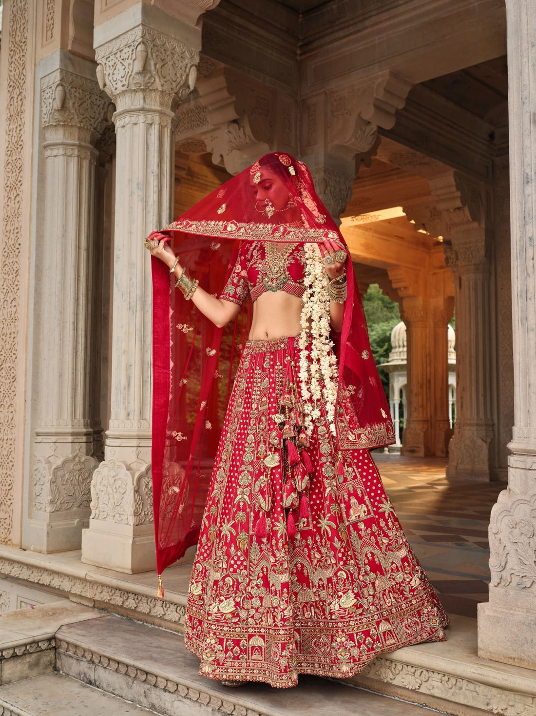 Regal Red Bridal Lehenga with Temple Motifs and Zari Embroidery