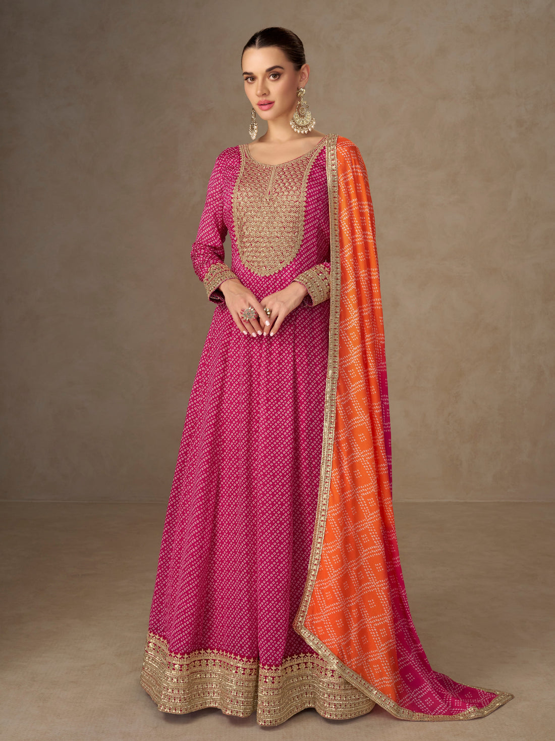 Pink Anarkali suit with orange dupatta for wedding reception