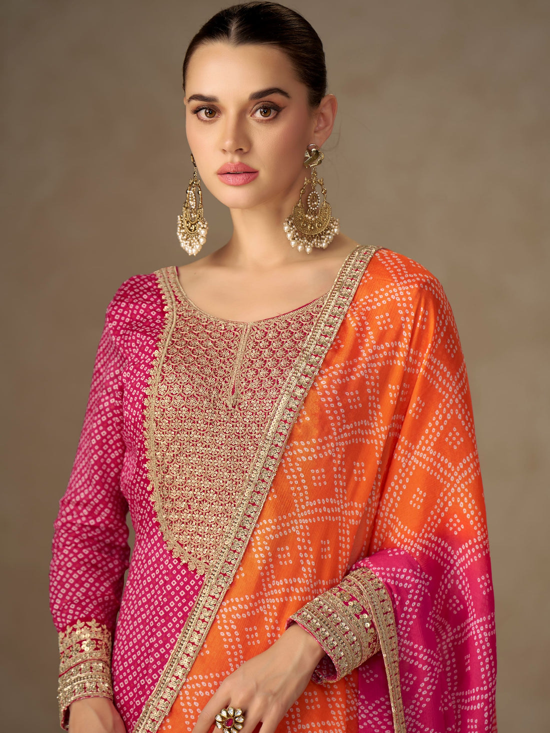 Pink Anarkali suit with orange dupatta for wedding reception