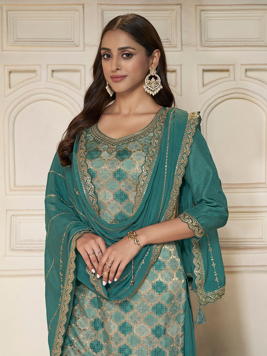 Dola silk kurta and chinon sharara set for festive wear