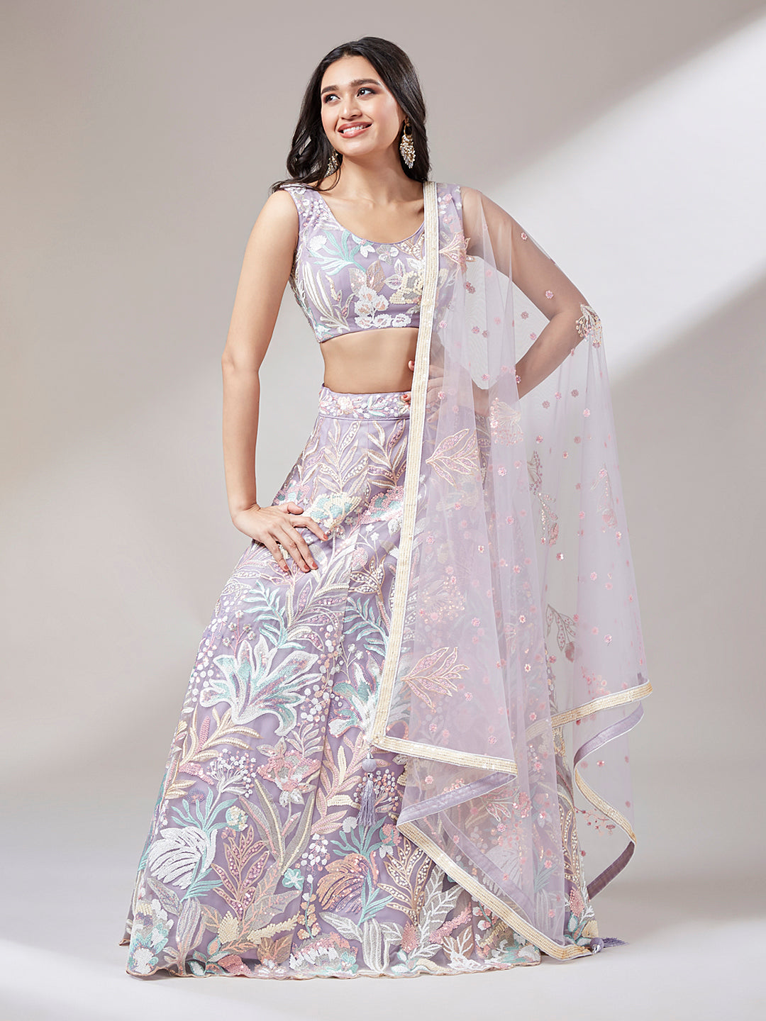 Close-up of sequin embroidery on mauve lehenga