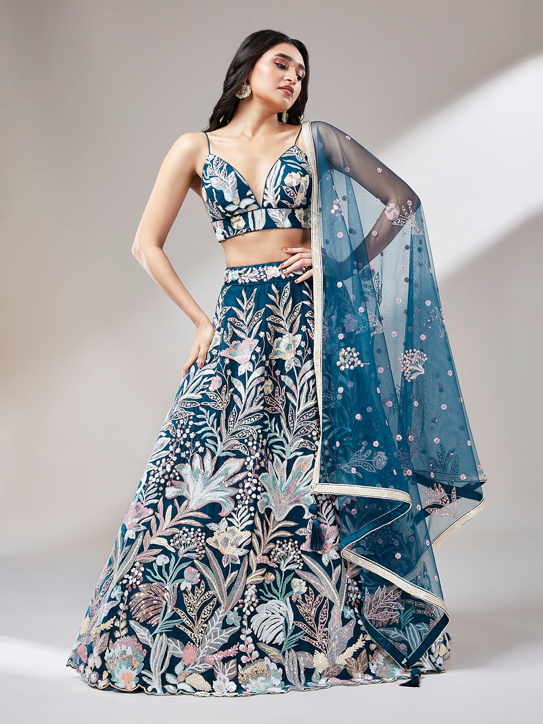 Front view of embroidered navy lehenga choli