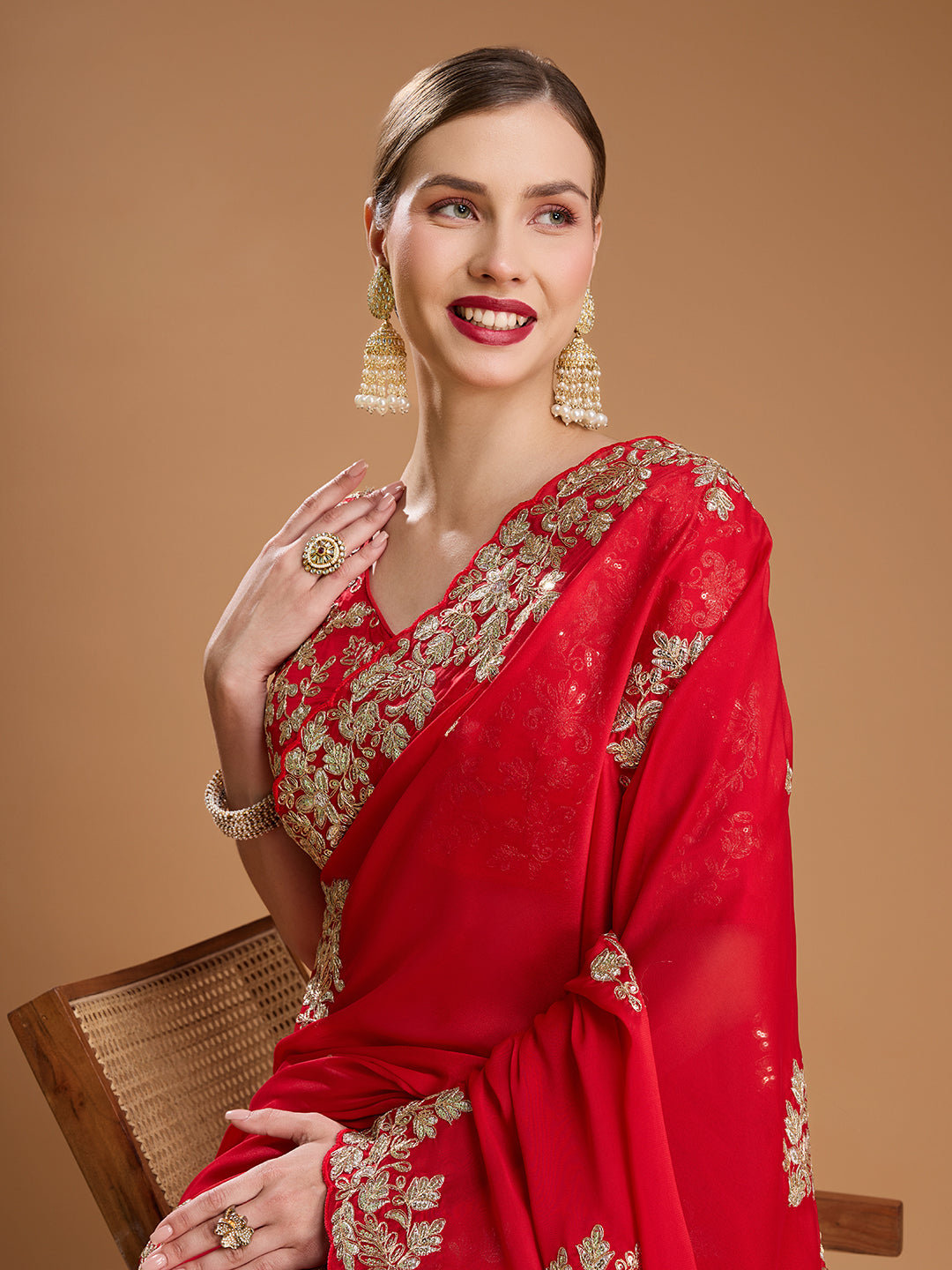 Bridal red saree with heavy golden coding work