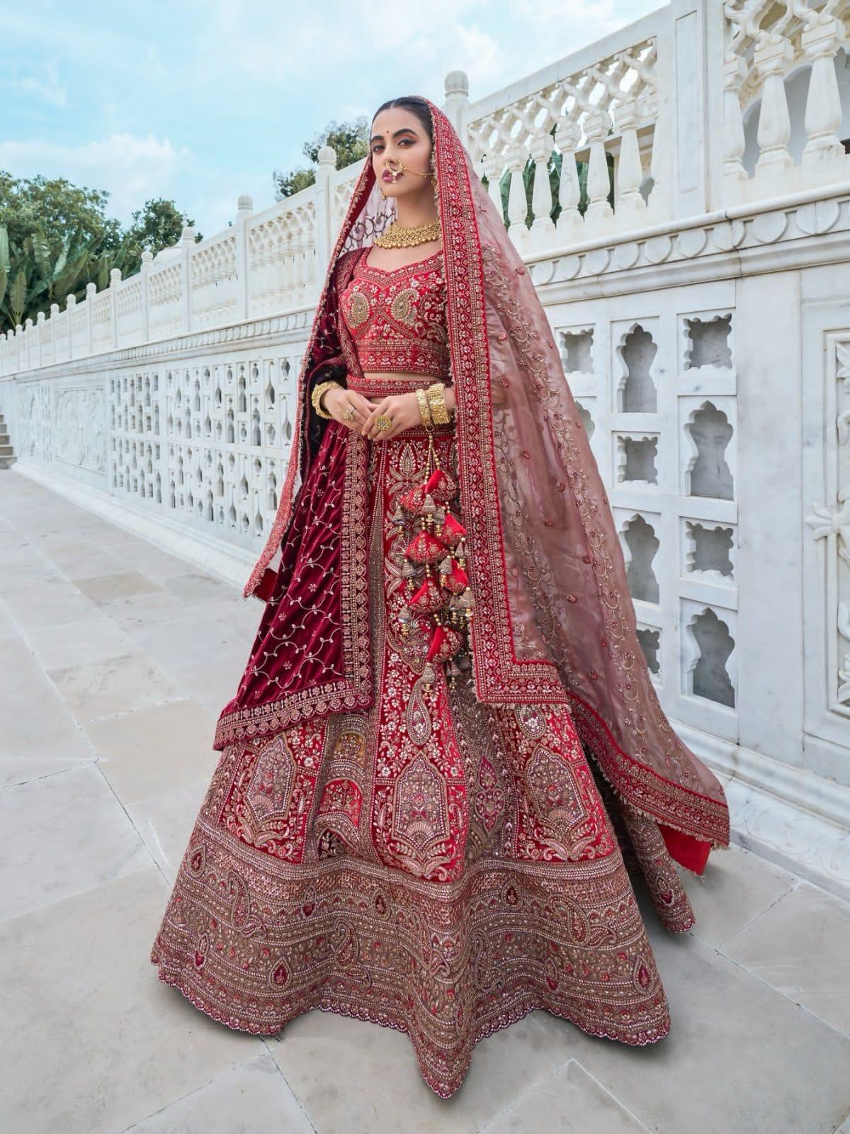 Luxurious maroon bridal lehenga choli with intricate embroidery.