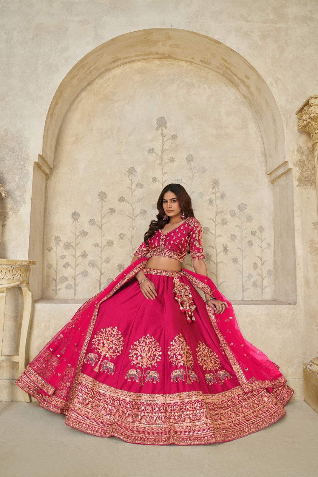 Rani Pink Silk Lehenga with Golden Elephant Embroidery Silk lehenga Anant Tex Exports Pvt.Ltd..
