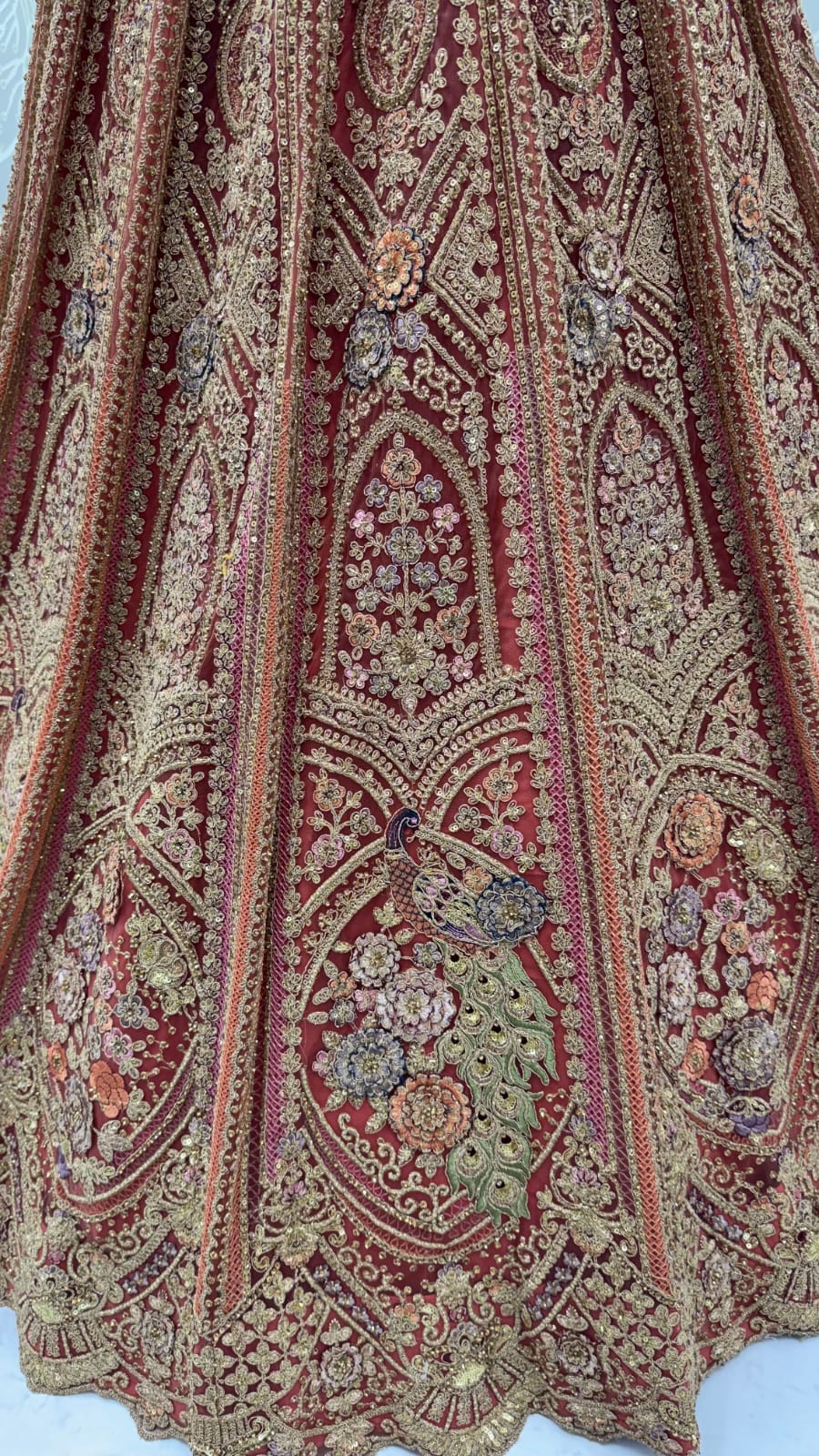 Peach Pure Heavy Net Peacock Pattern Multi Thread Sequins Work Net Bridal Lehenga Choli