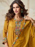 Floral embroidery details on yellow palazzo suit