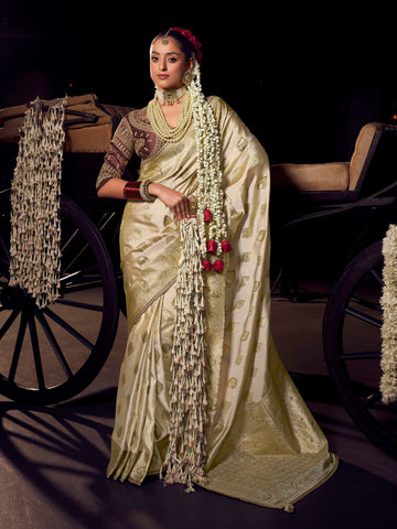 Cream and gold Banarasi saree with maroon contrast heavy embroidered blouse