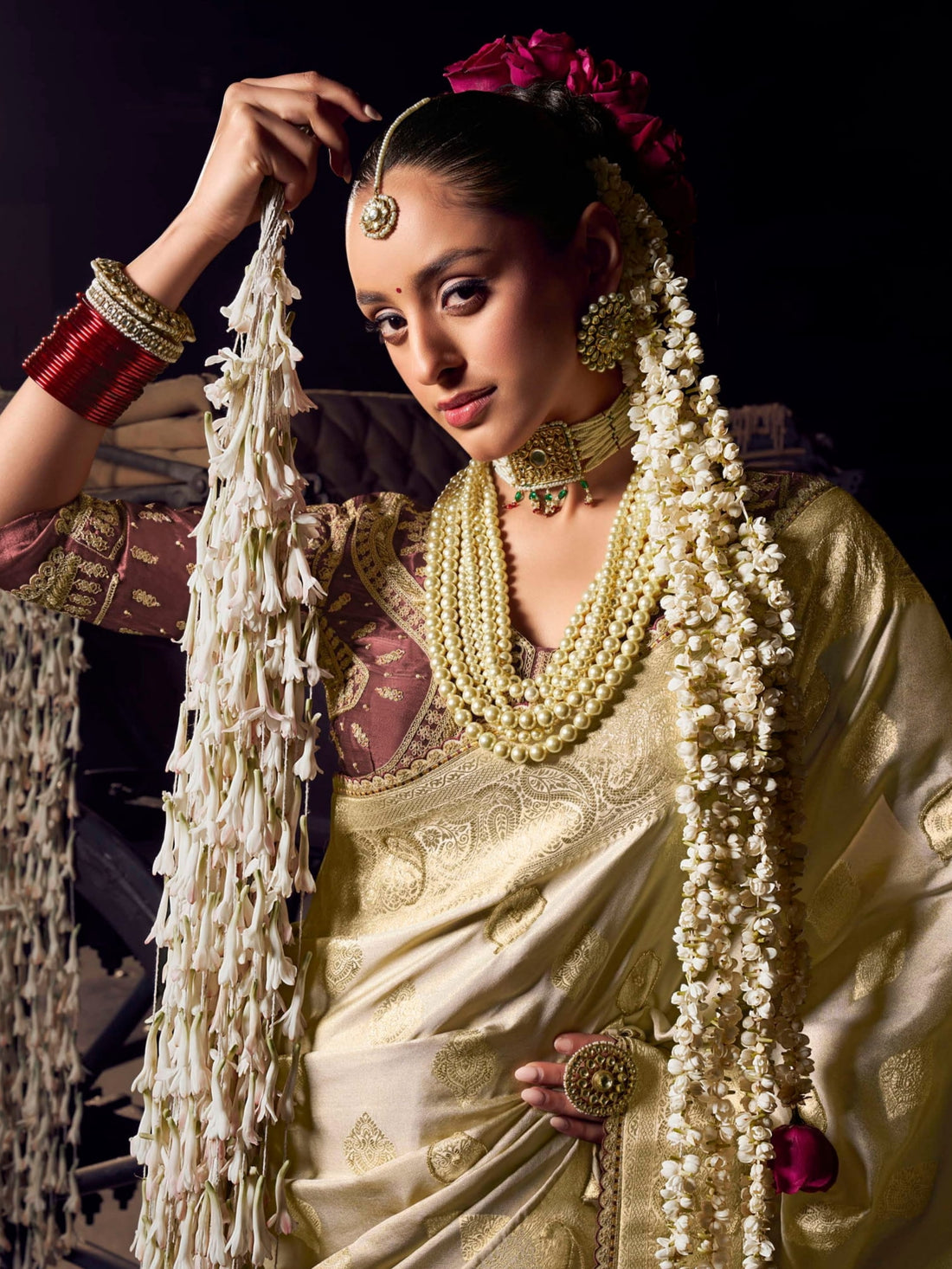 Cream and gold Banarasi saree with maroon contrast heavy embroidered blouse