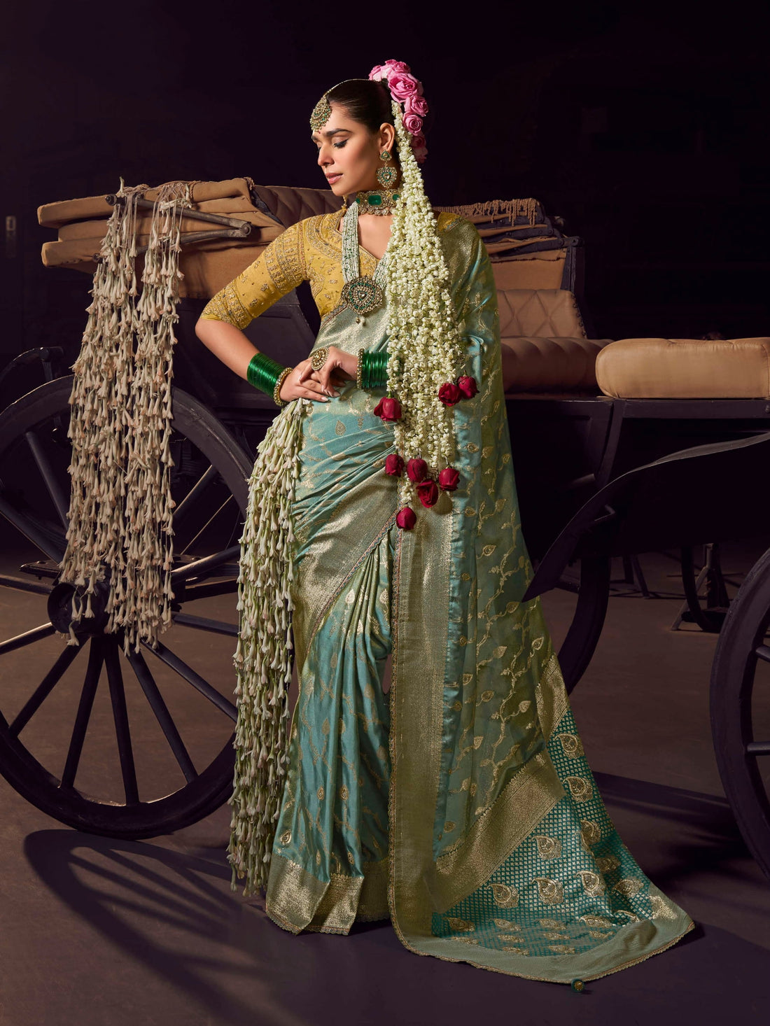 Mint green Banarasi saree with mustard heavy embroidered designer blouse