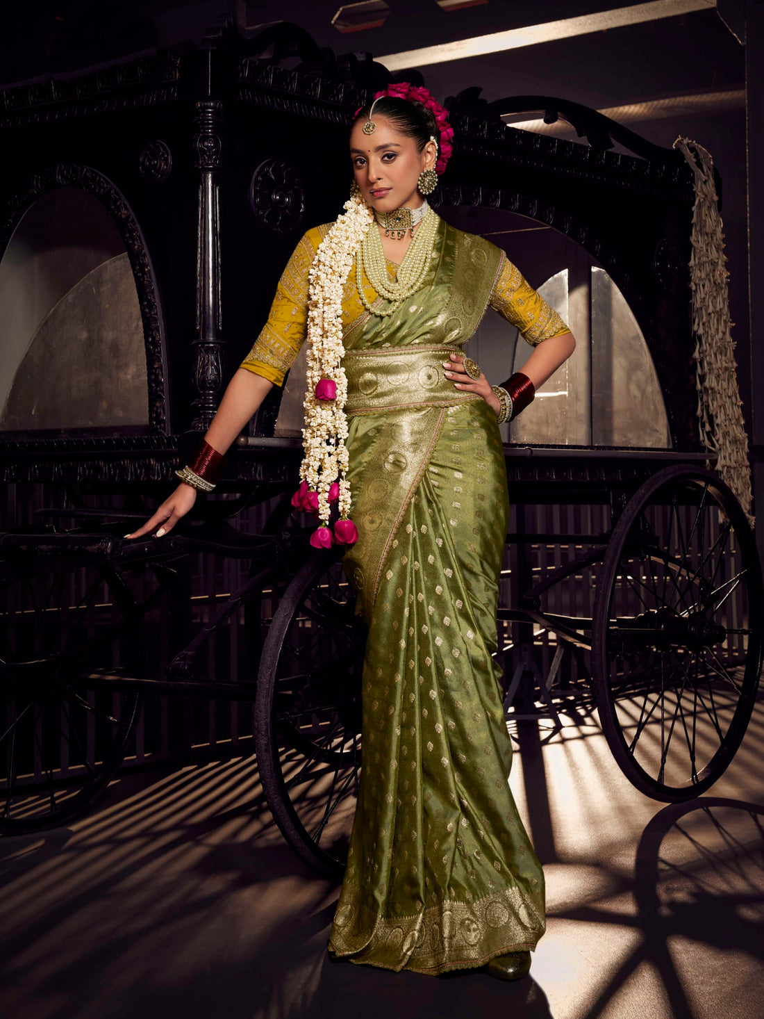 Olive green Banarasi saree with mustard yellow contrast heavy embroidered blouse