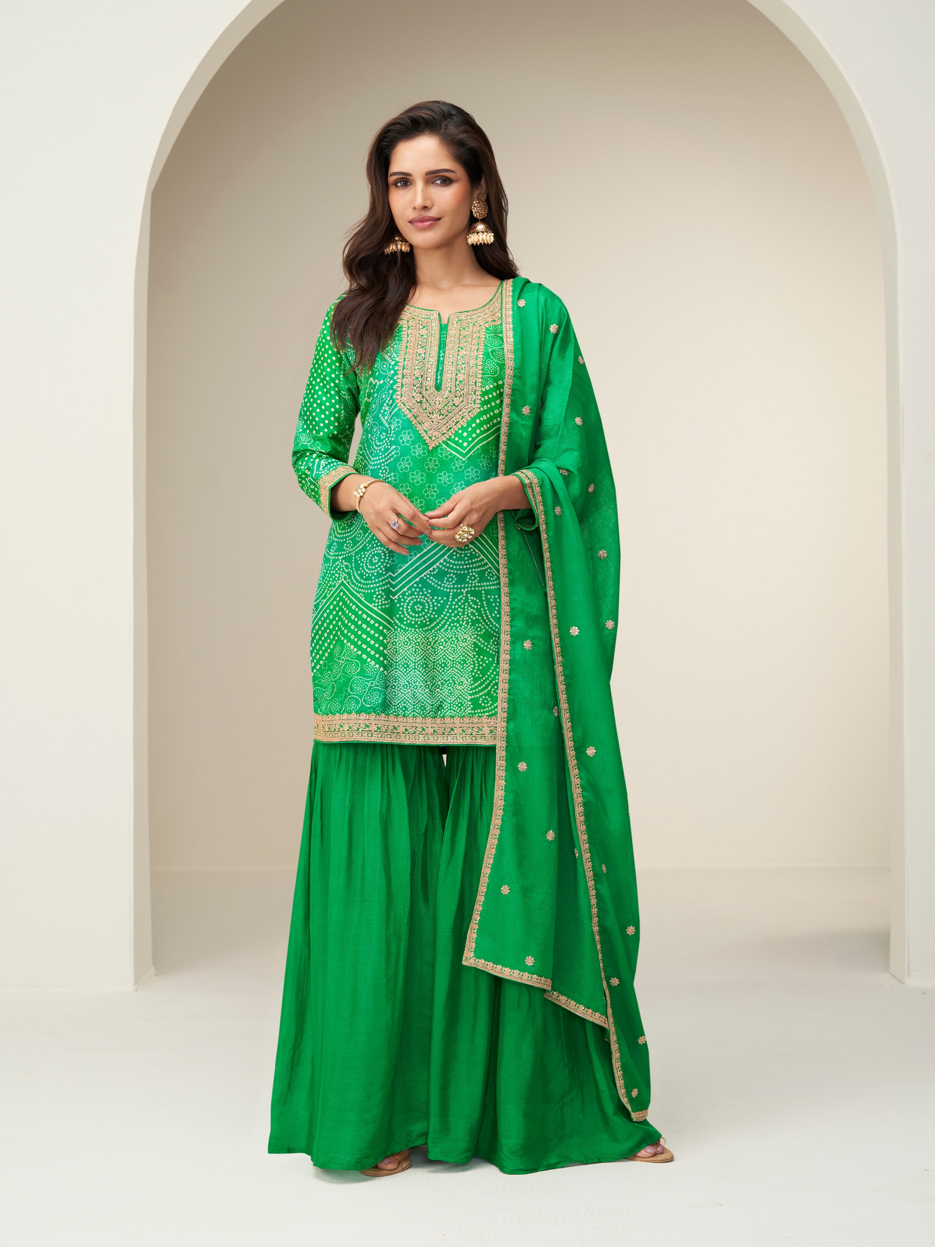 Green chinnon silk sharara suit with embroidered kurti