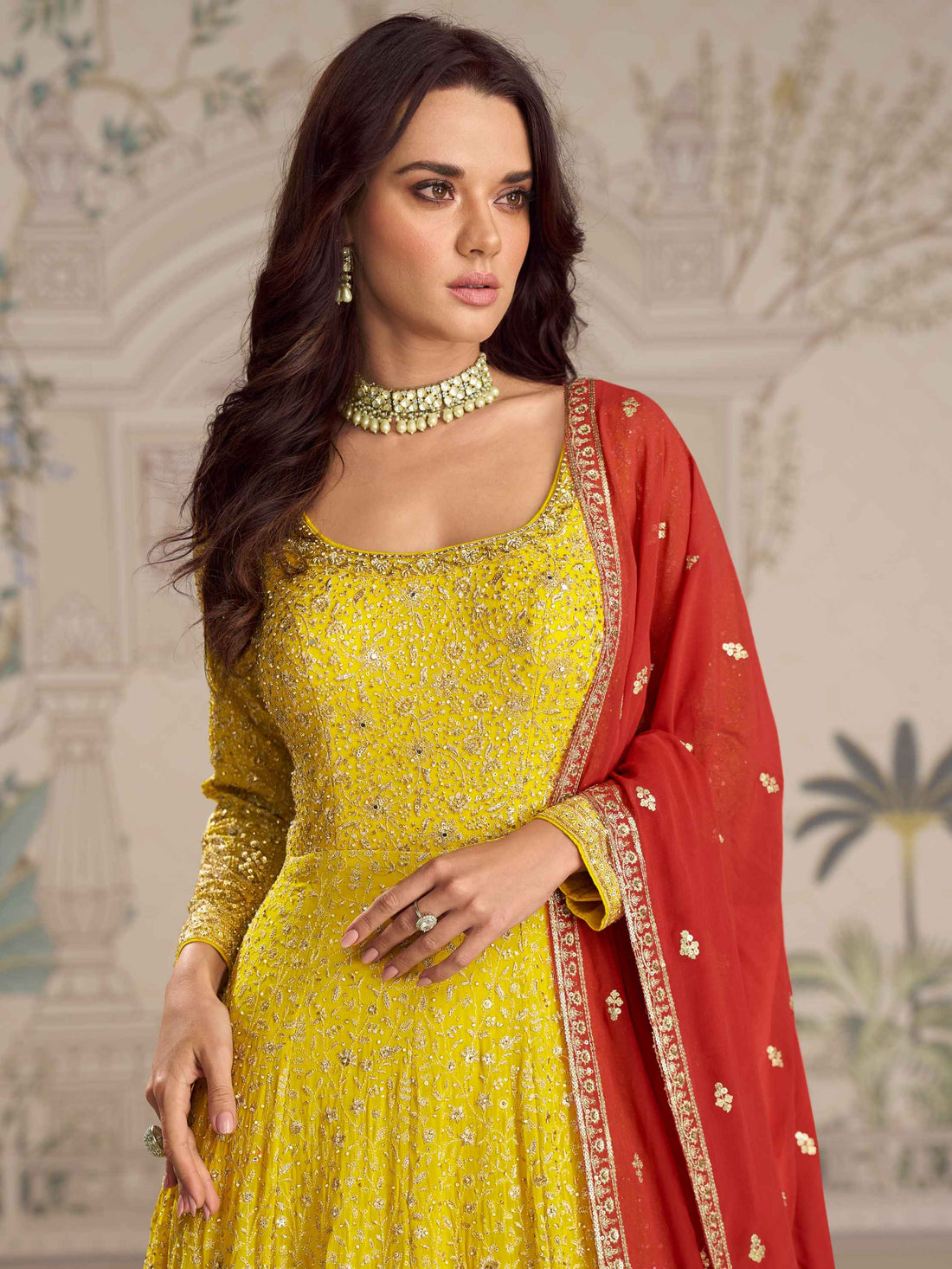 Yellow Anarkali gown with red embroidered dupatta