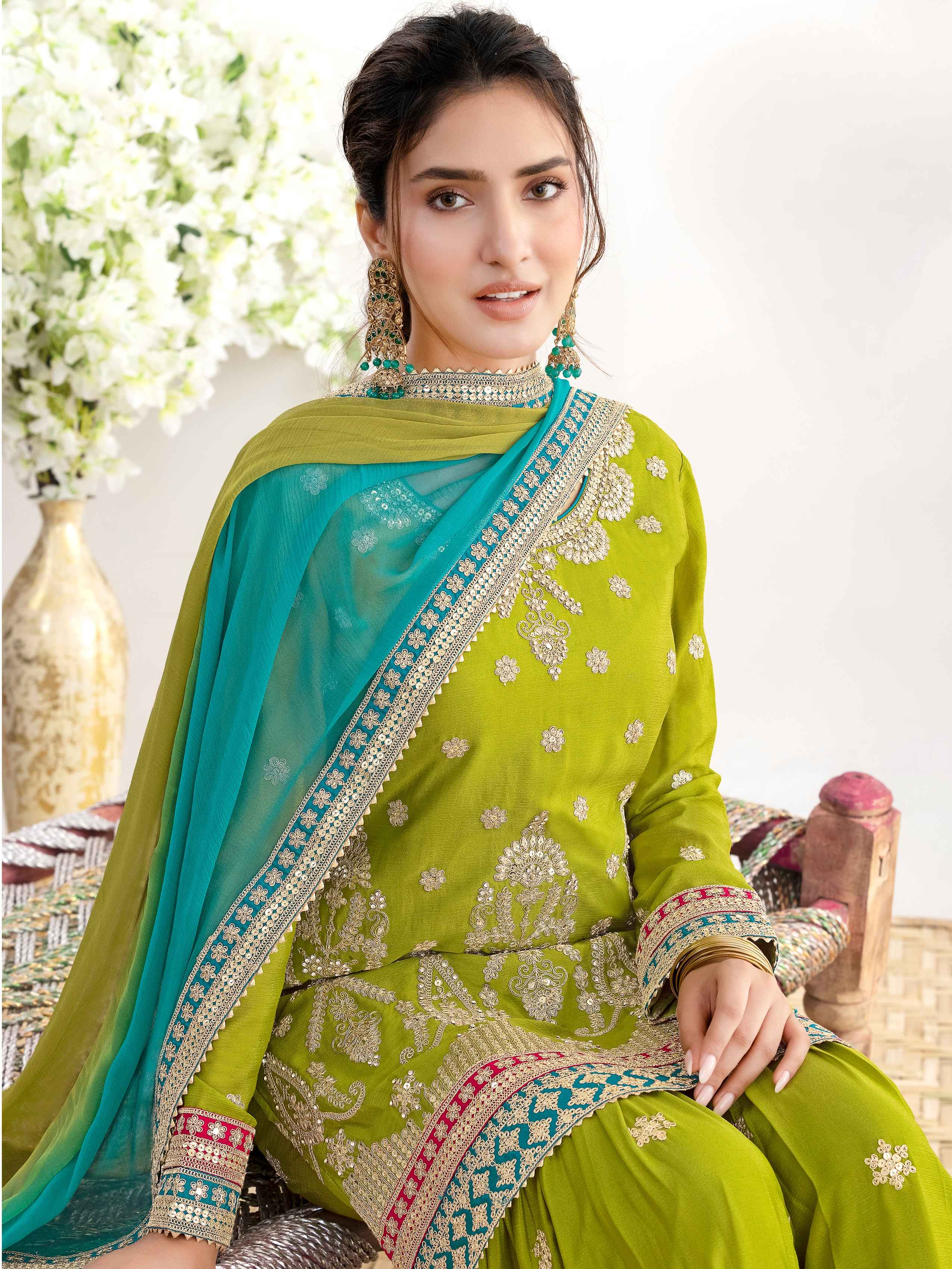 Green Heavy Embroidered Chinnon Sharara Suit with Dual Shade Dupatta Sharara Suit Anant Tex Exports Pvt.Ltd..