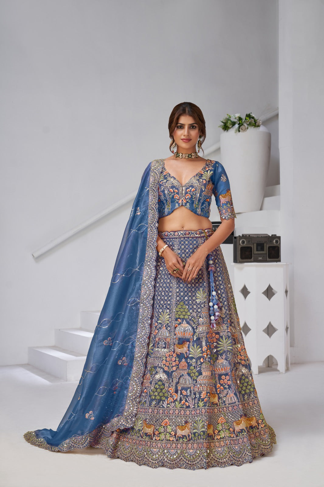 Blue Organza Tissue Bridal Lehenga with Temple & Kamdhenu Cow Motifs Organza Lehenga Anant Tex Exports Pvt.Ltd..