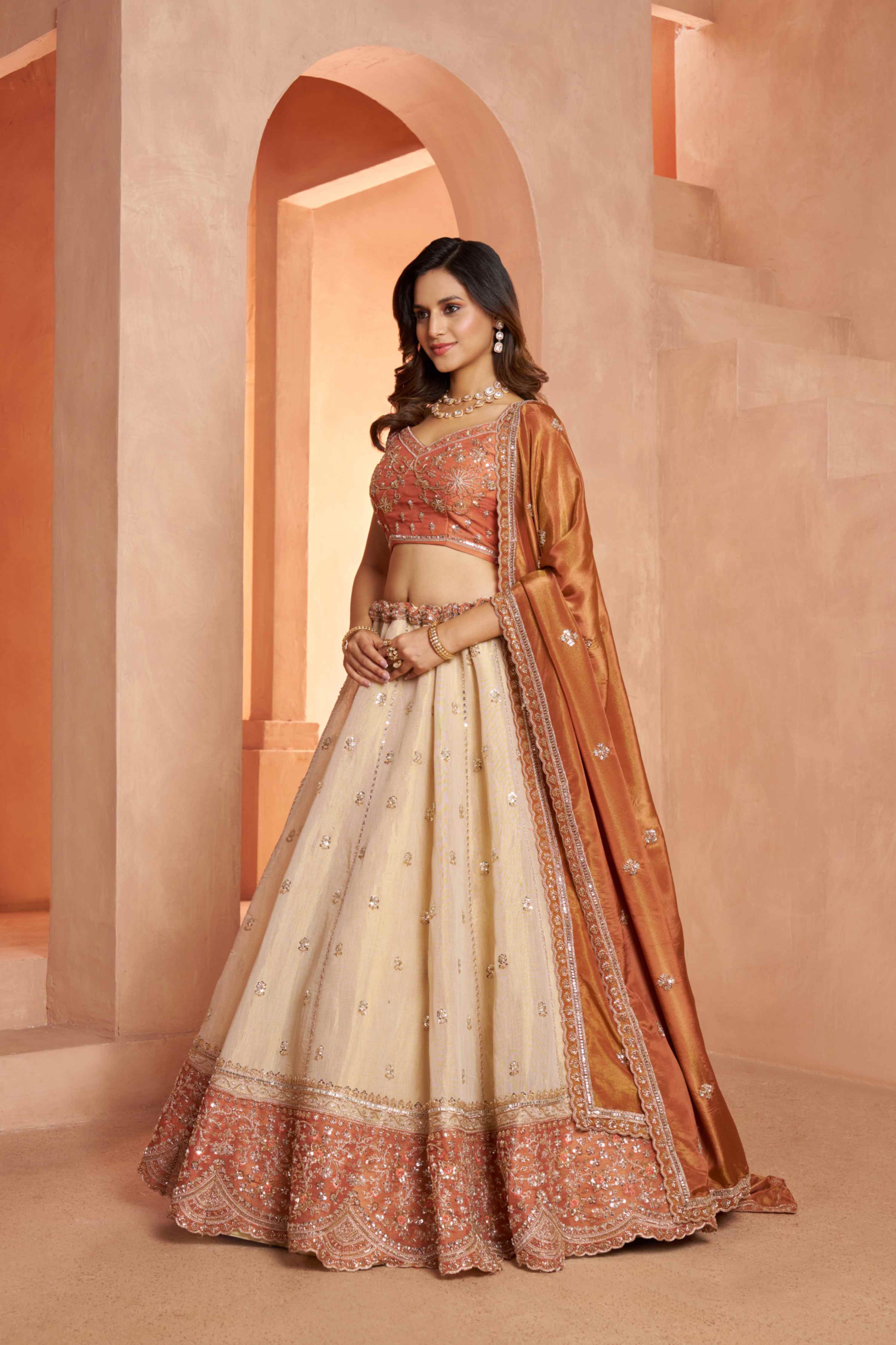 Peach Beige Kanjivaram Tissue Silk Embroidered Lehenga Choli