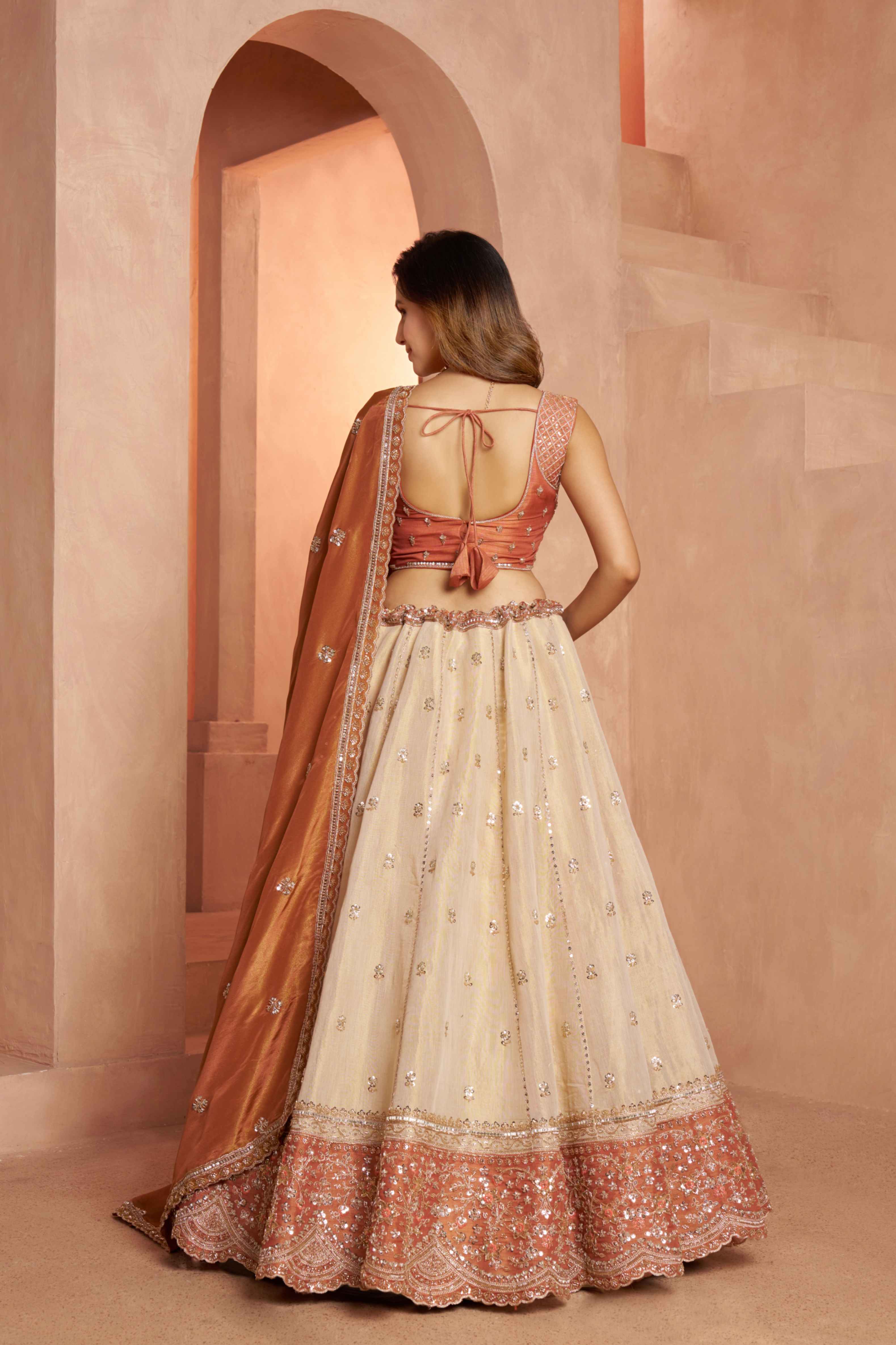 Peach Beige Kanjivaram Tissue Silk Embroidered Lehenga Choli