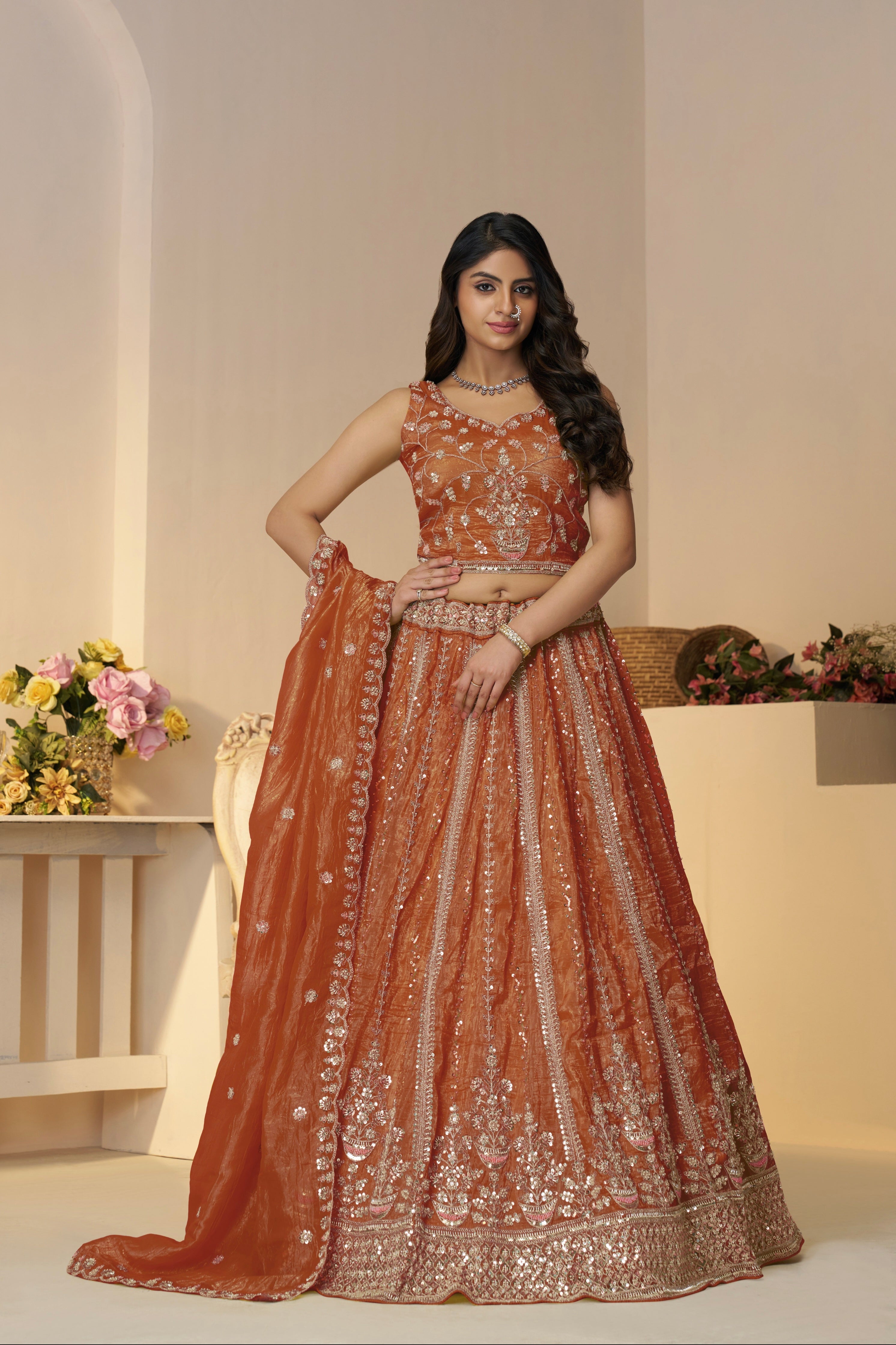 Wedding lehenga in orange with handcrafted blouse and dupatta