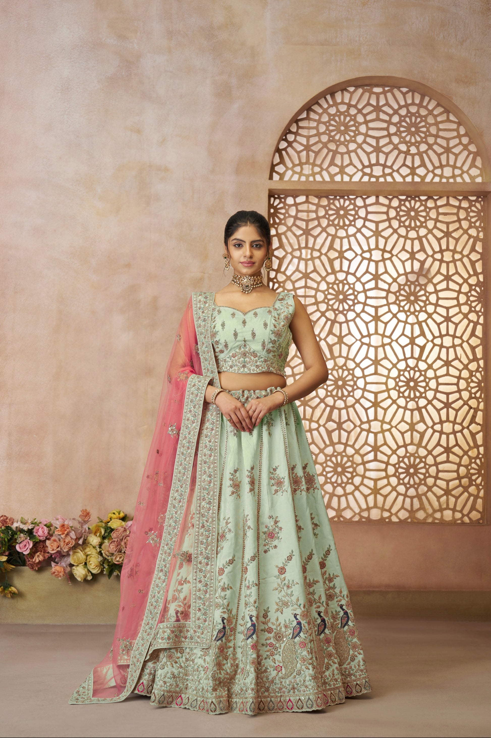 Designer green silk lehenga choli with vibrant peacock embroidery for weddings