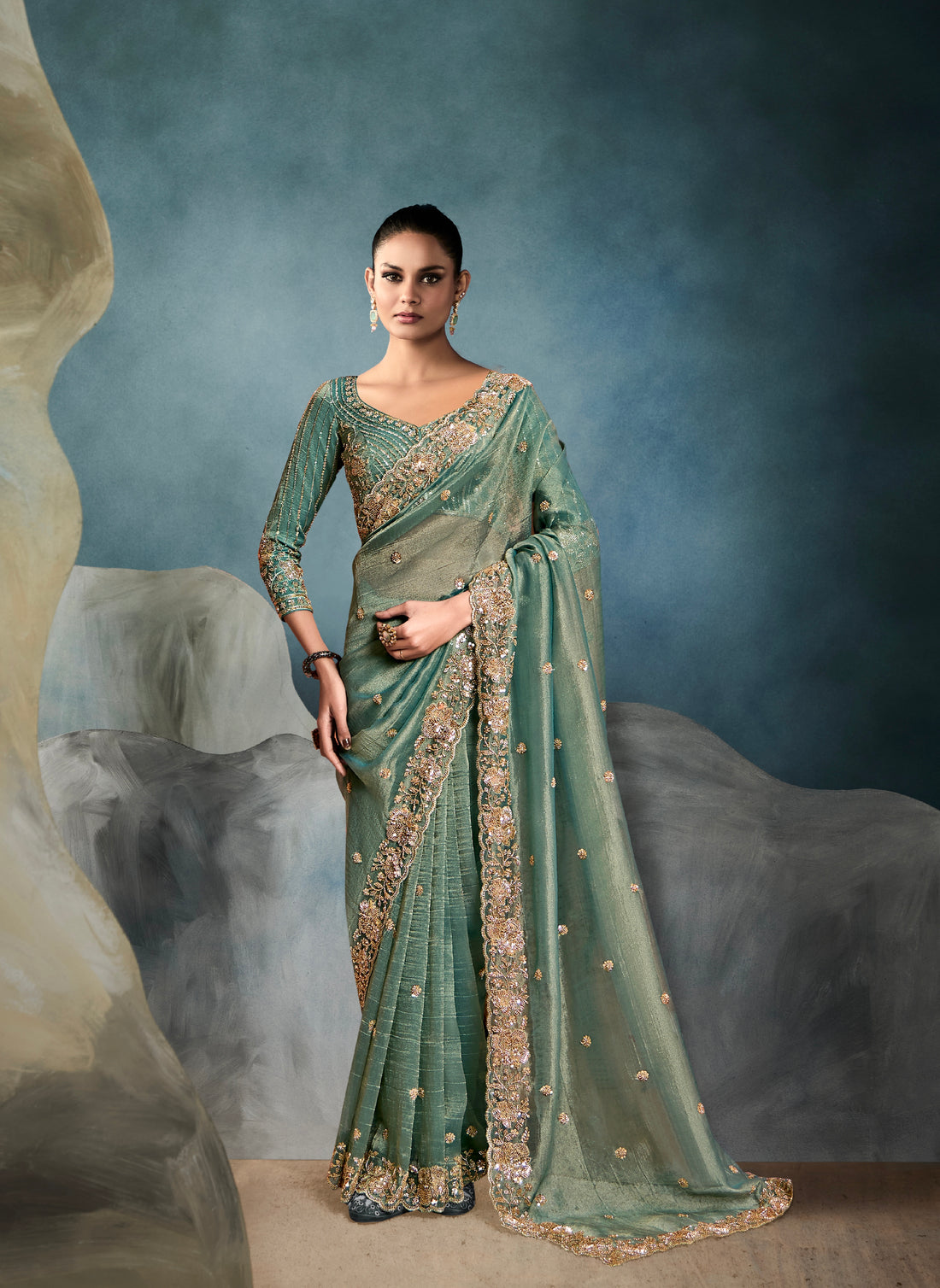 Sage green tissue saree with hand embroidery work