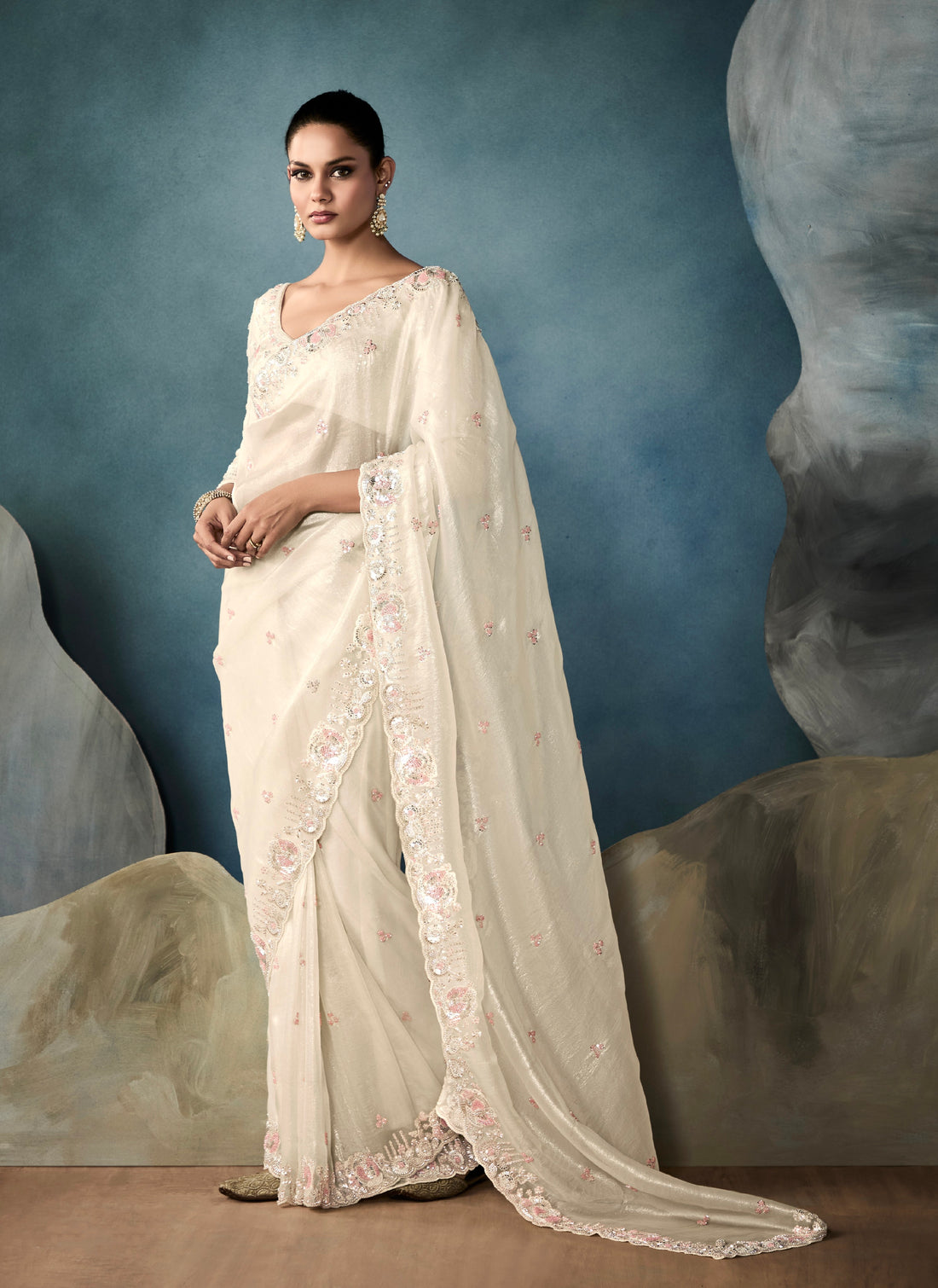 Off-white tissue saree with hand embroidery and designer border