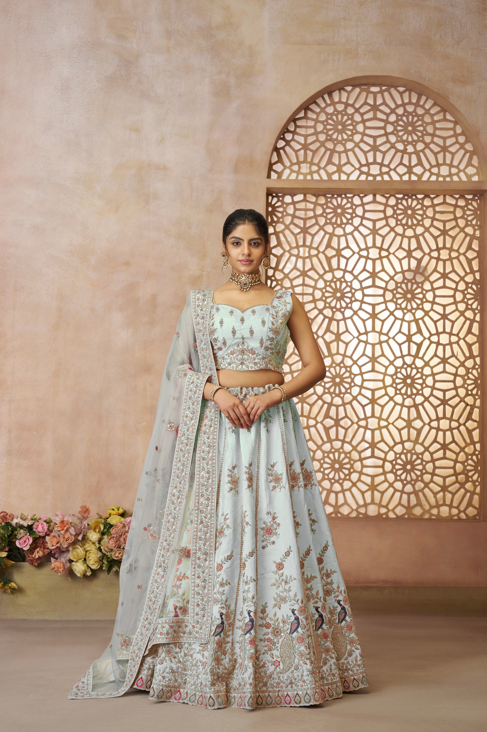 Zari silk lehenga in sky blue with intricate peacock motif for Indian brides