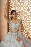 Designer sky blue bridal lehenga in silk with traditional peacock pattern work