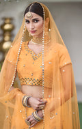 Close-up of yellow choli with intricate mirror detailing