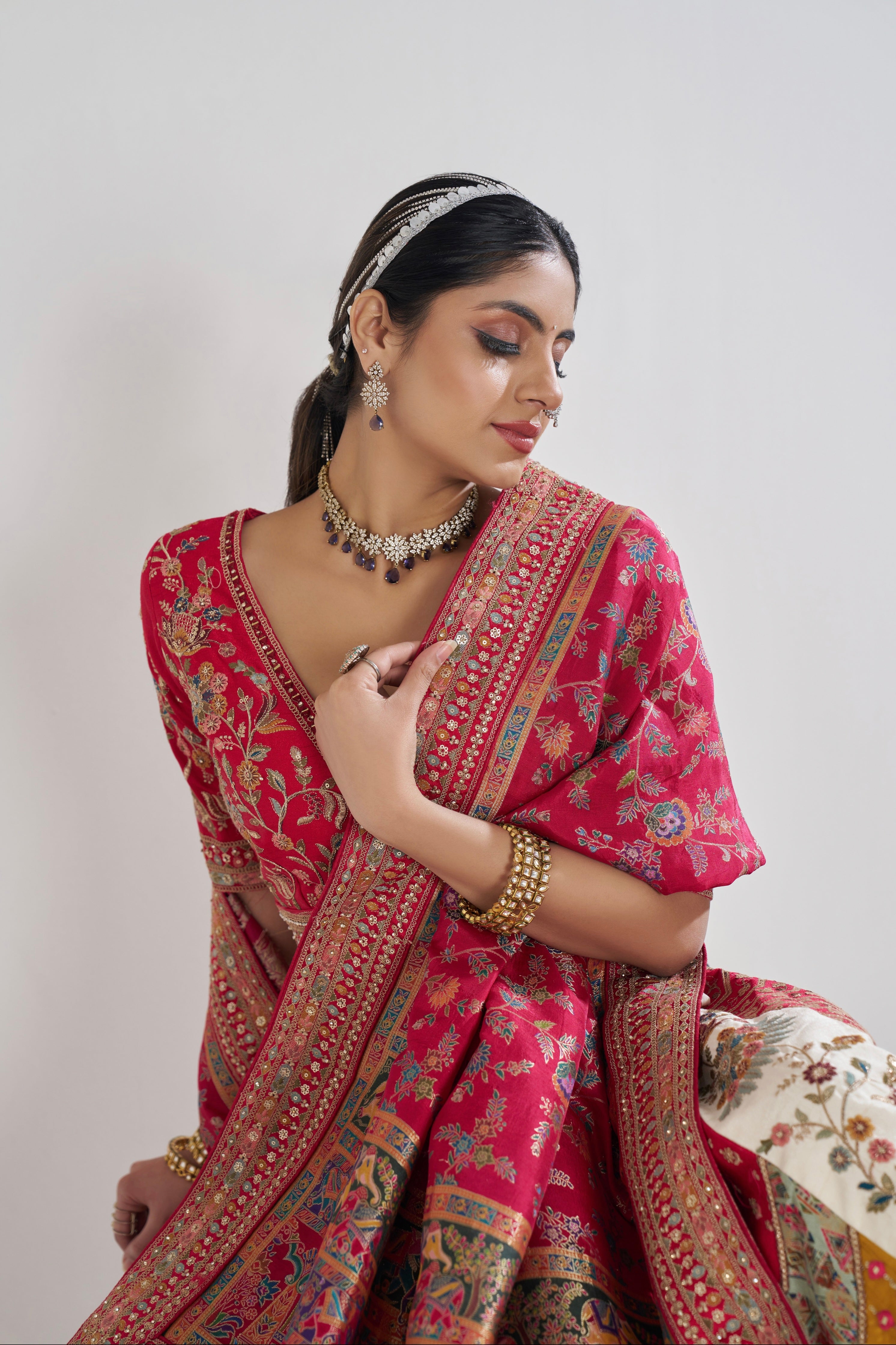 Ethnic red dupatta paired with ivory Banarasi lehenga
