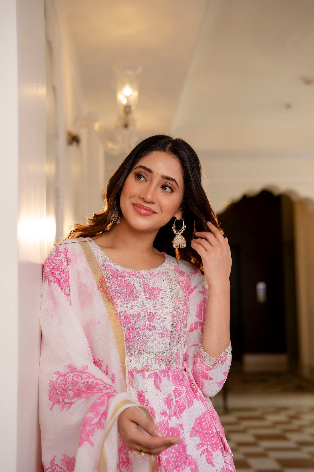 Woman wearing Pink and White Printed Viscose Rayon Kurti, Pant, and Dupatta Set