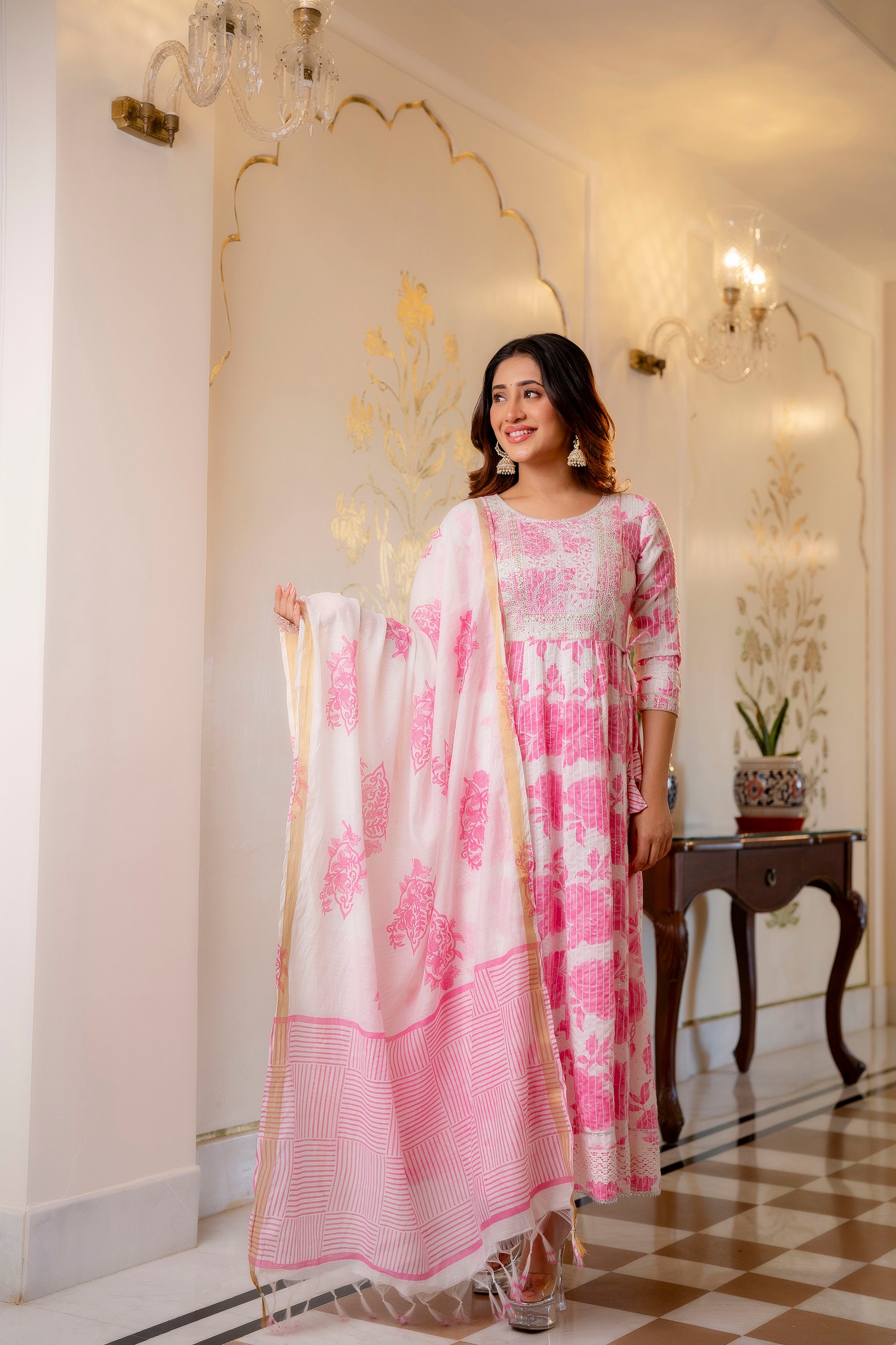 Woman wearing Pink and White Printed Viscose Rayon Kurti, Pant, and Dupatta Set