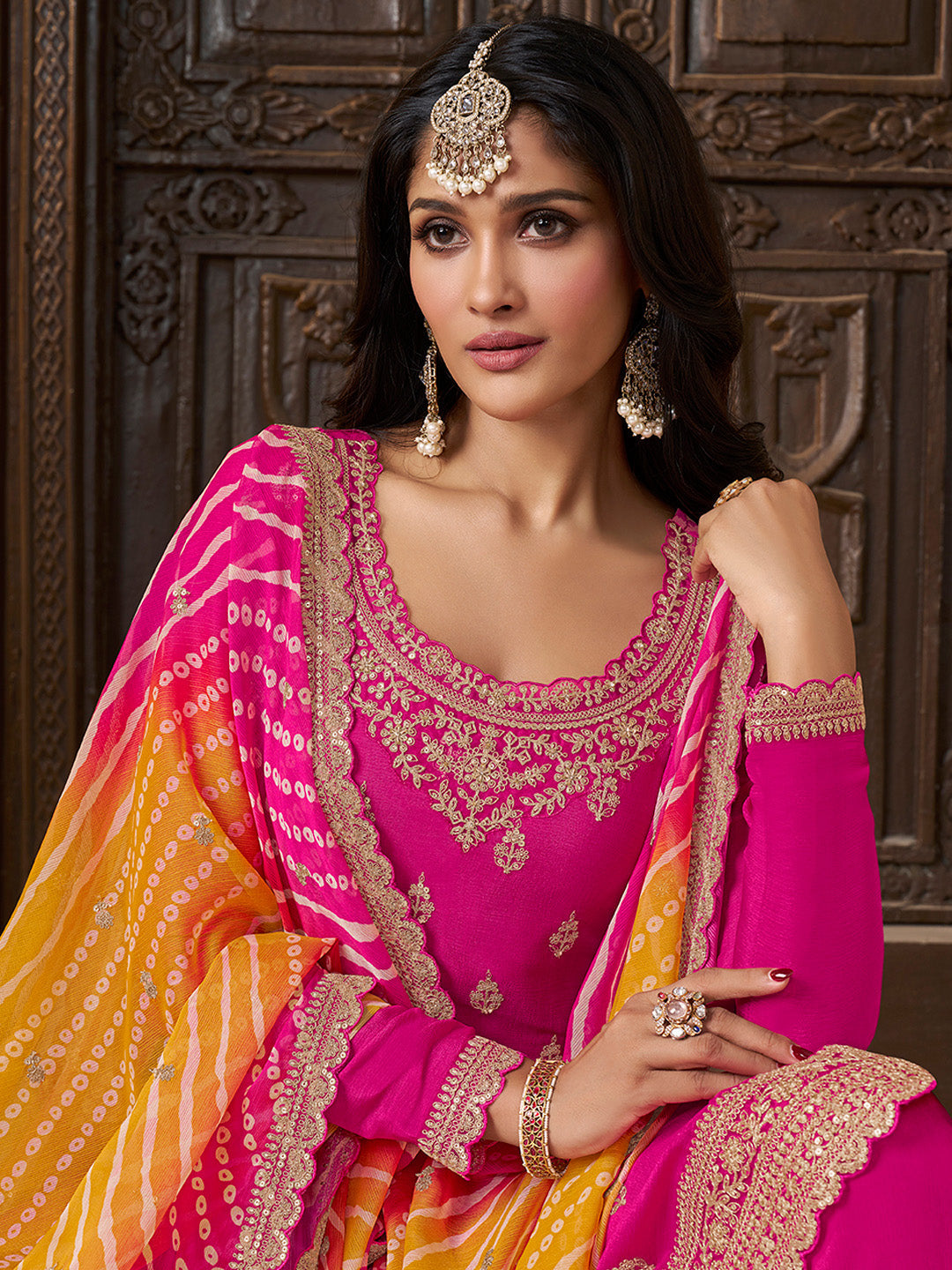 Rani pink sharara suit with sequin embroidery and Bandhani dupatta

