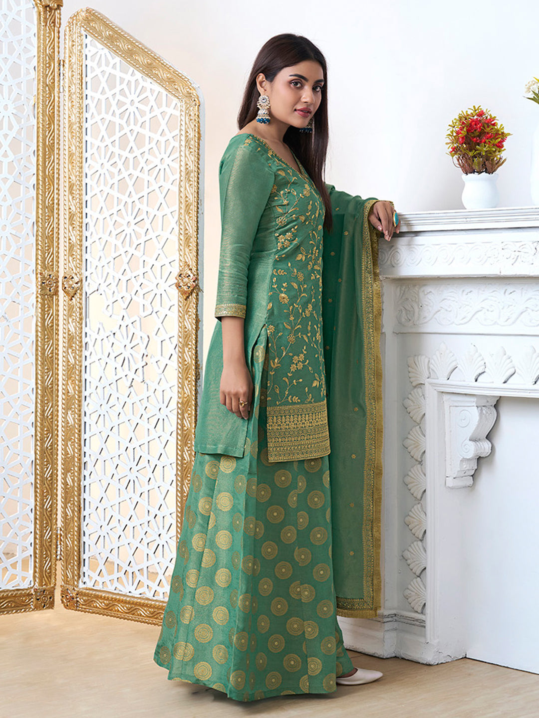 Embroidered tissue sharara suit in mehendi green with tassel dupatta