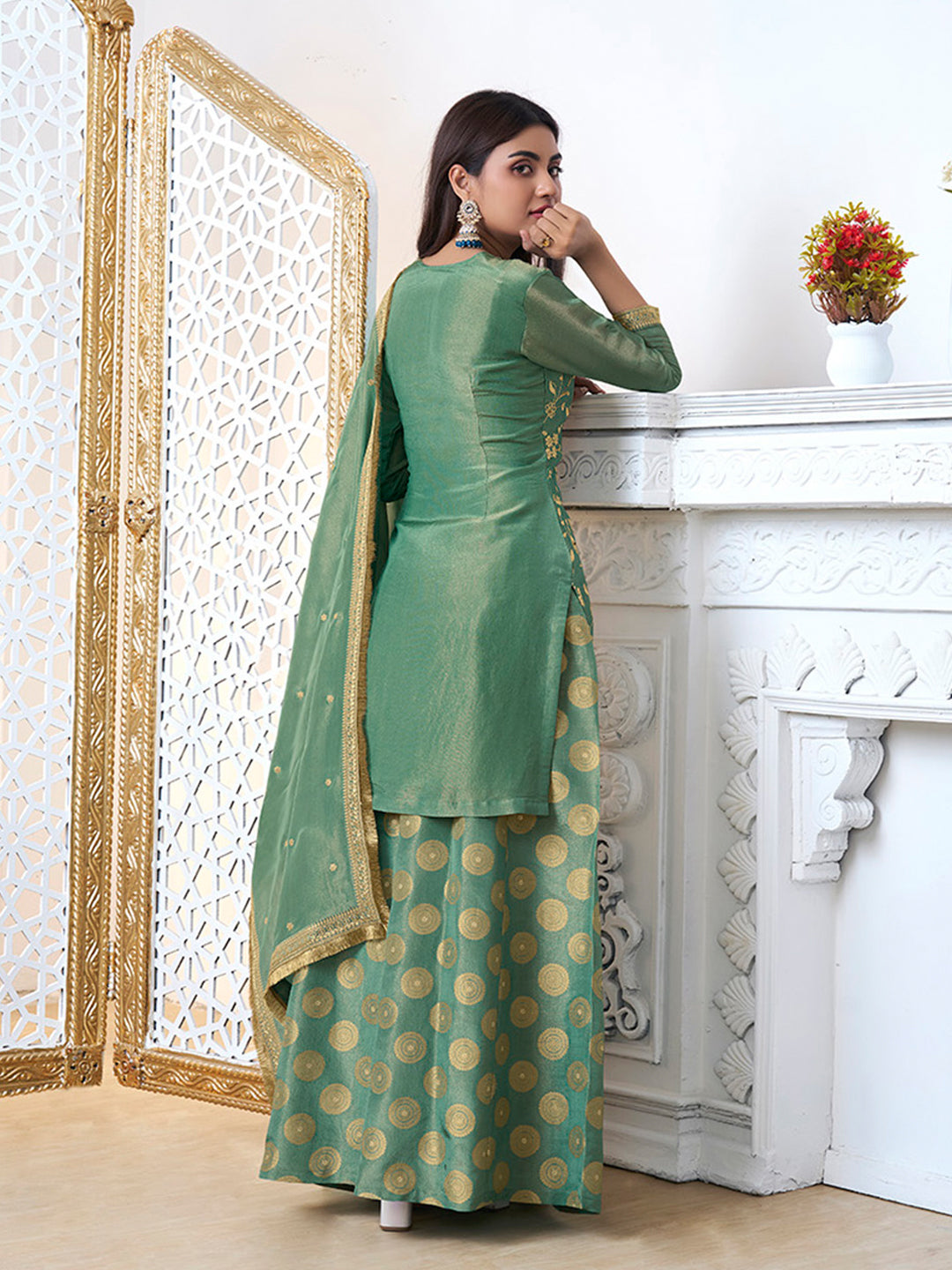 Green straight kurta sharara suit set with embroidered neck and daman