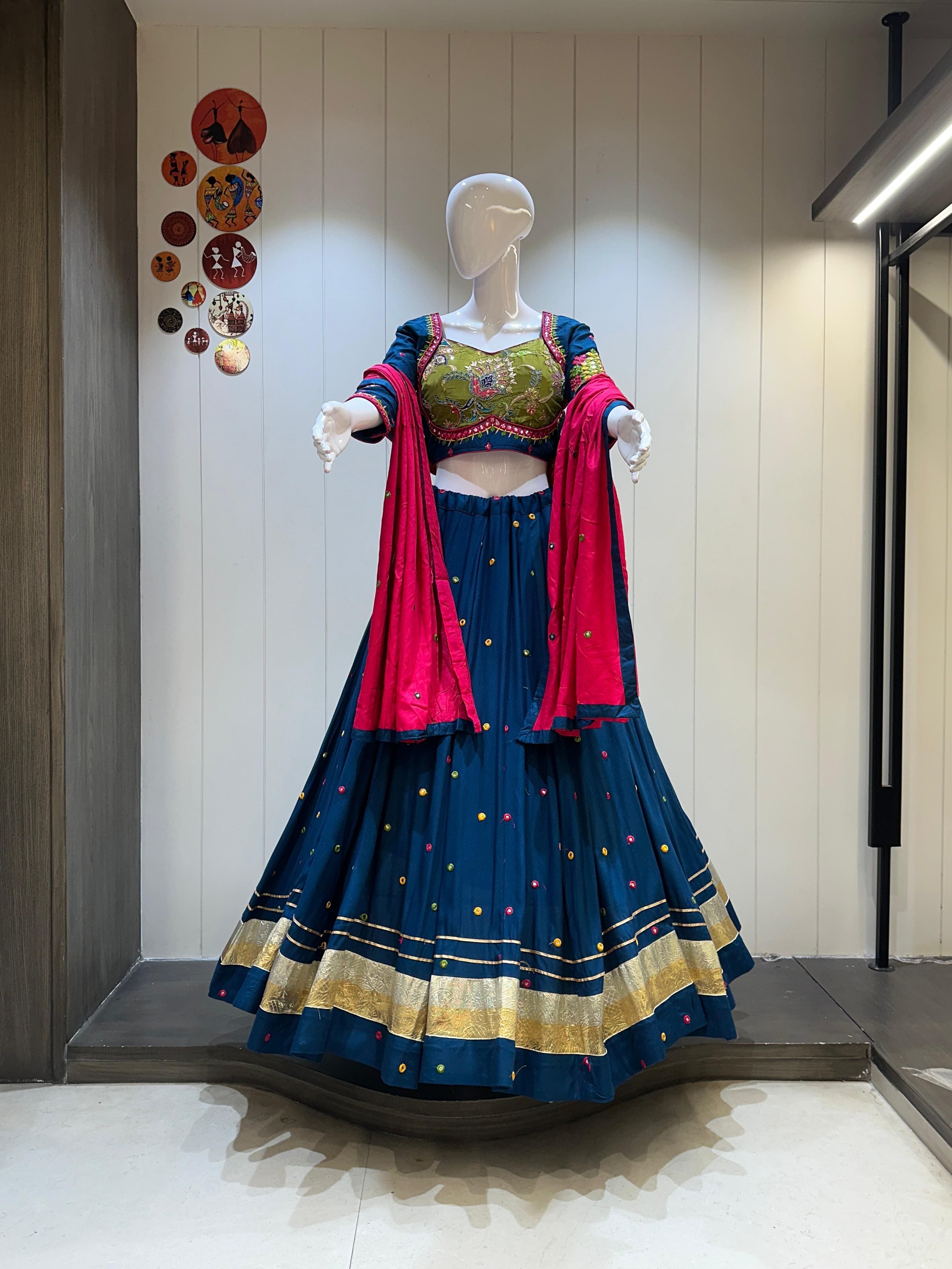 Blue chaniya choli with pink dupatta and gold edging

