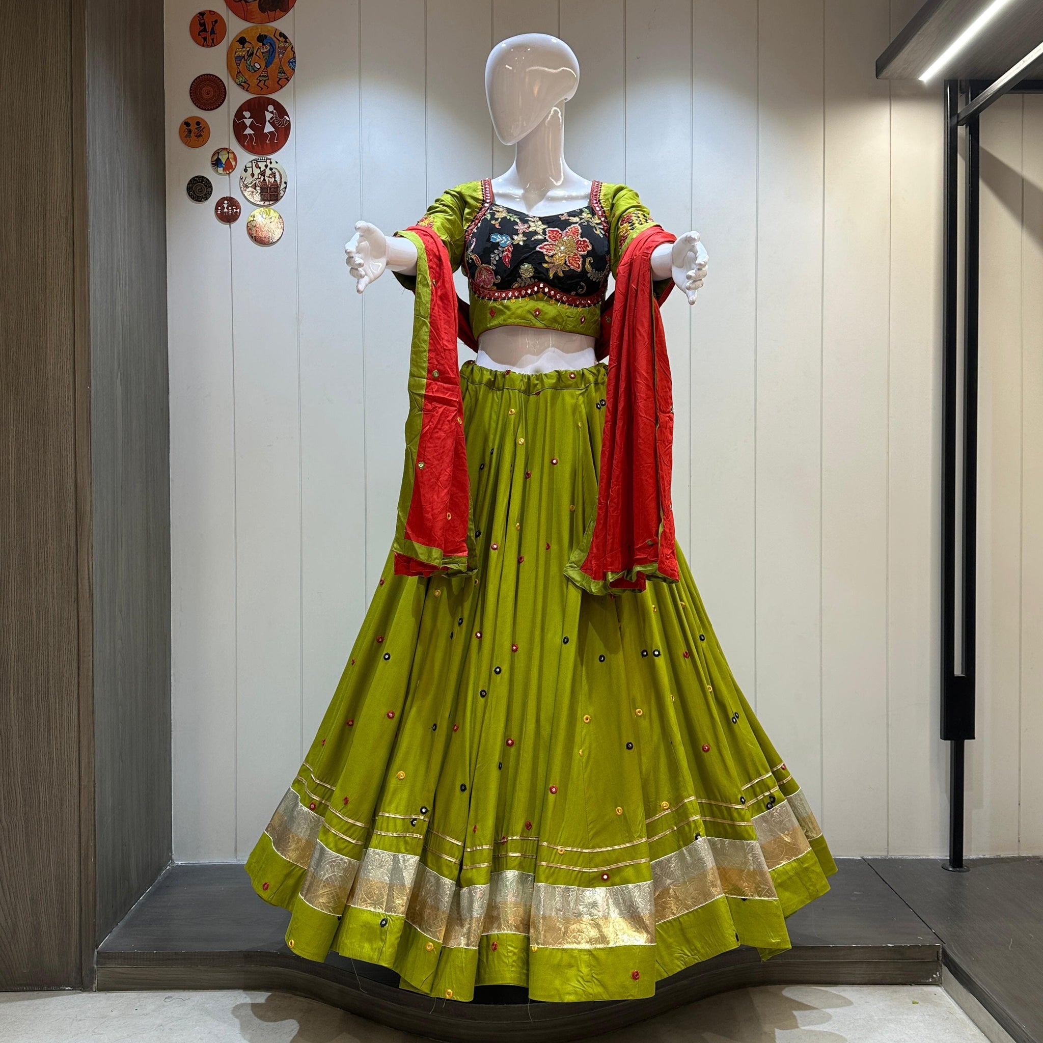 Green chaniya choli with red dupatta and gold hem

