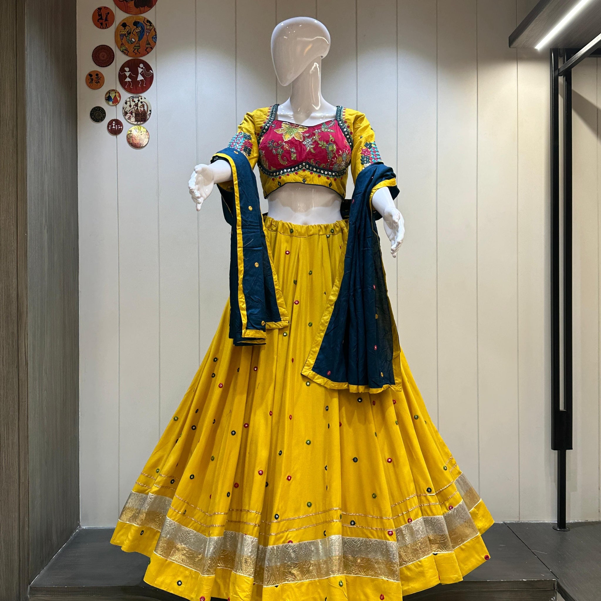 Yellow chaniya choli with blue dupatta and golden border

