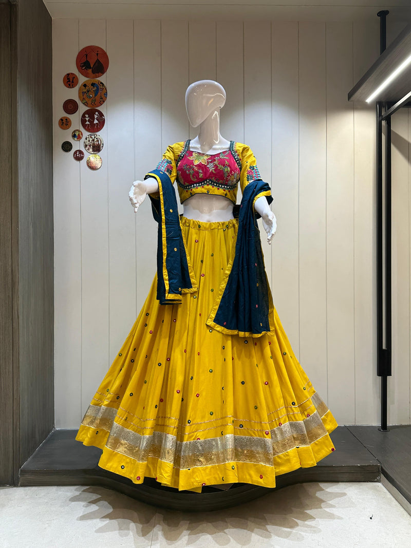 Yellow chaniya choli with blue dupatta and golden border

