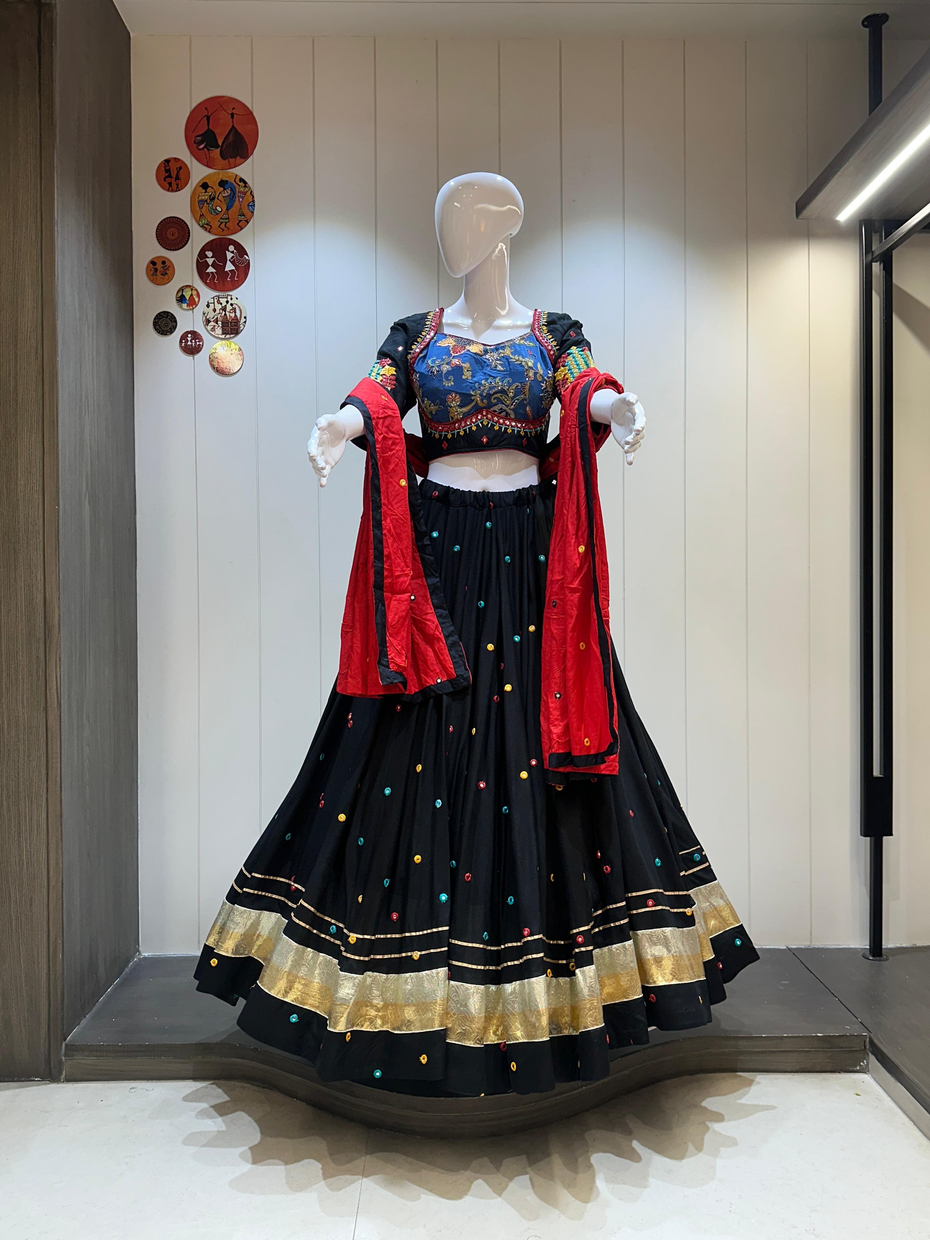Black chaniya choli with red dupatta and gold trim

