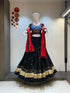 Black chaniya choli with red dupatta and gold trim

