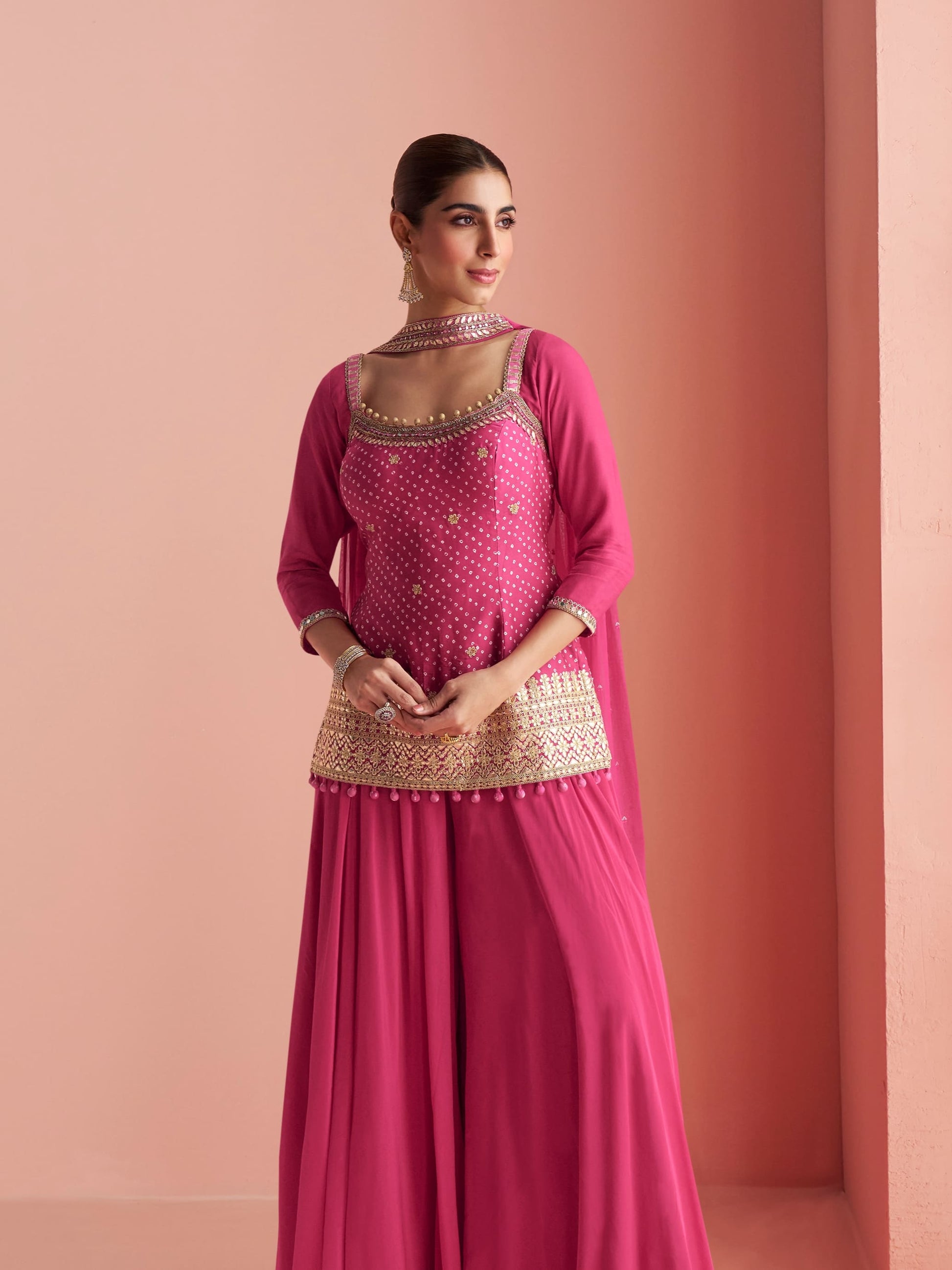 Premium silk palazzo set in pink with mirror work details