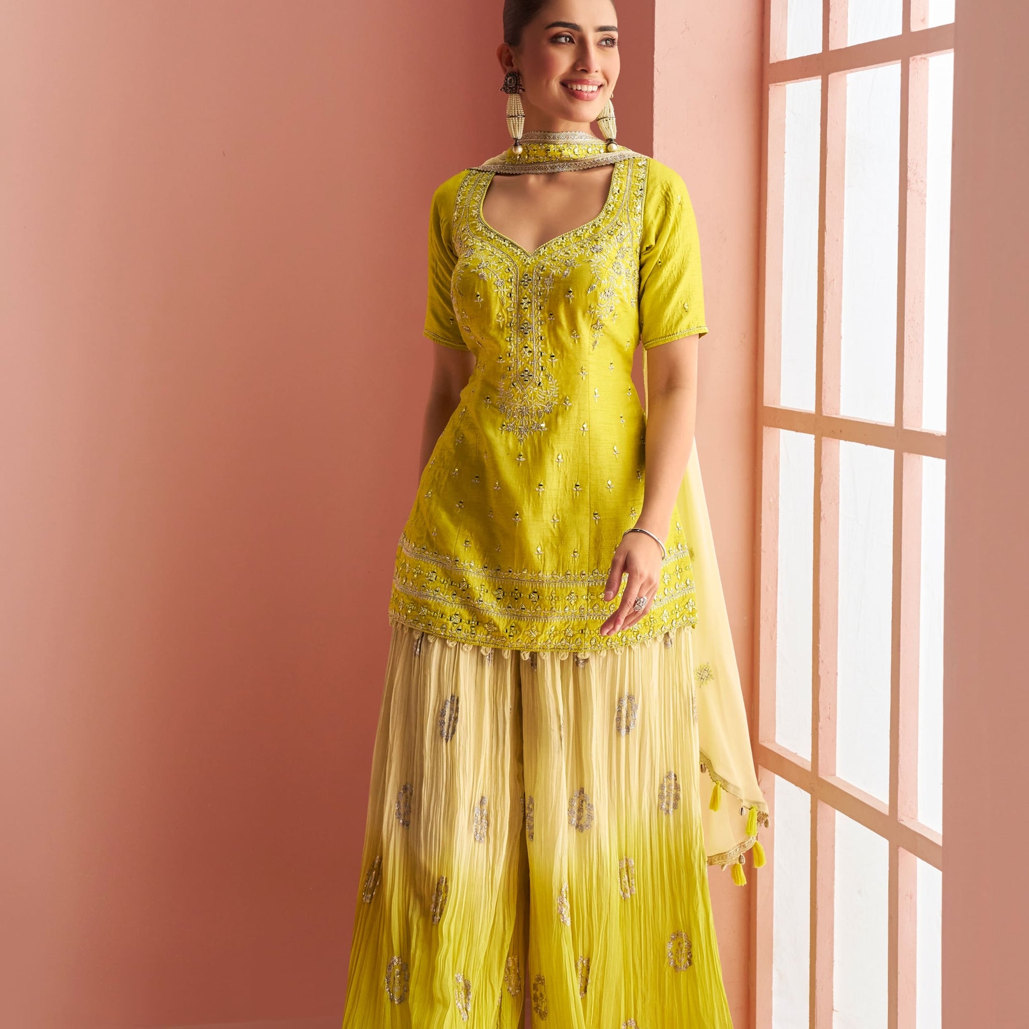 Yellow silk palazzo suit with embroidered kurti and dupatta