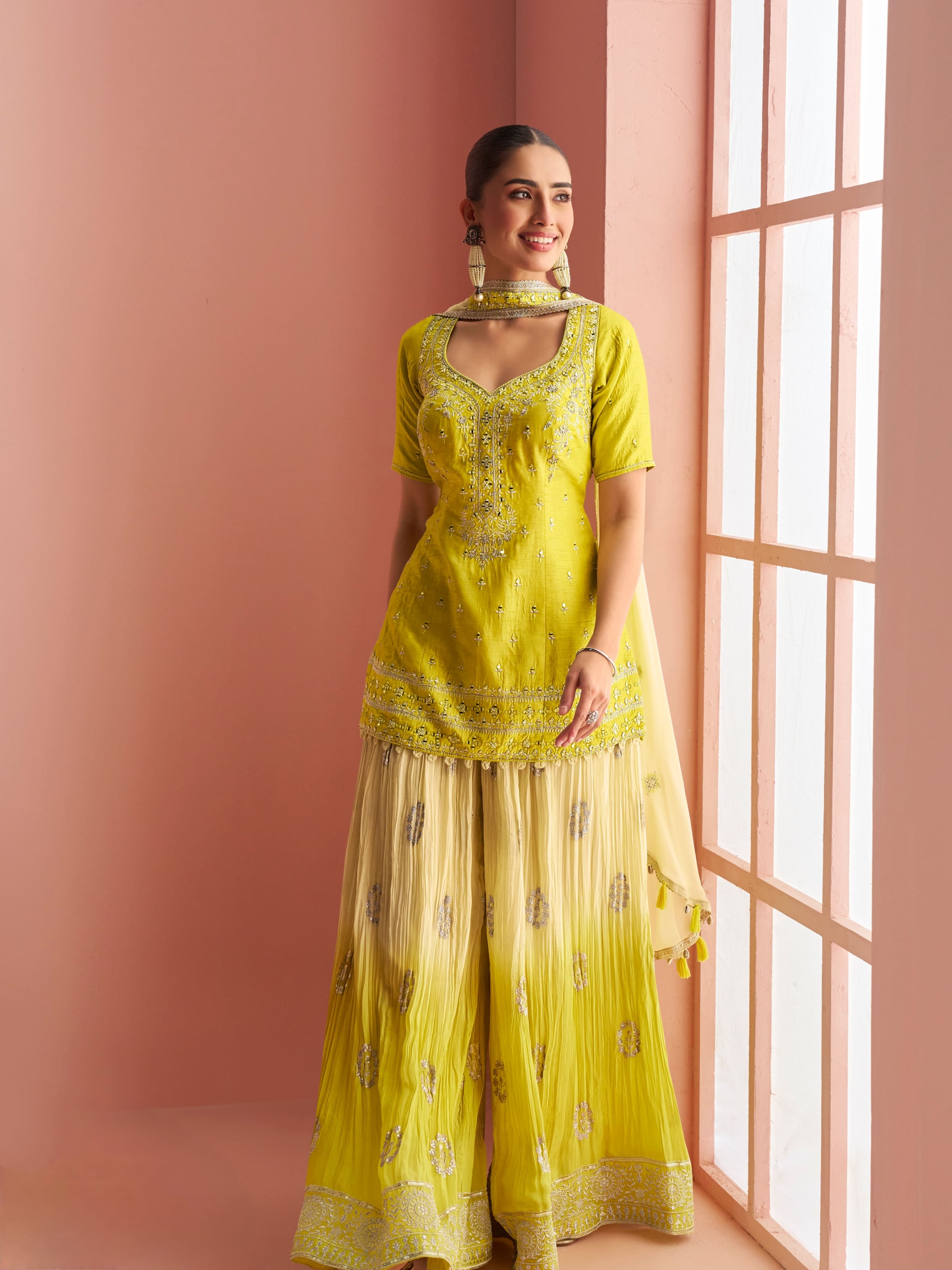 Yellow silk palazzo suit with embroidered kurti and dupatta