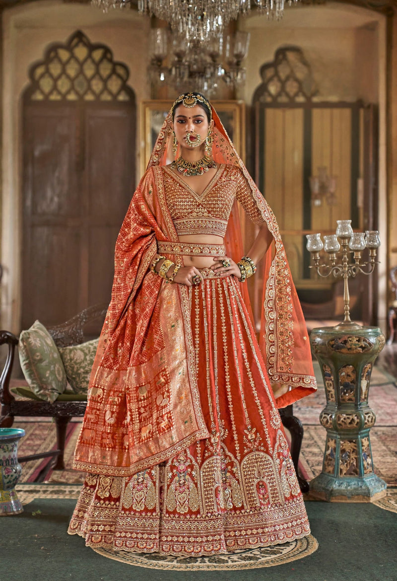 Orange bridal lehenga set with embroidered blouse and Banarasi dupatta