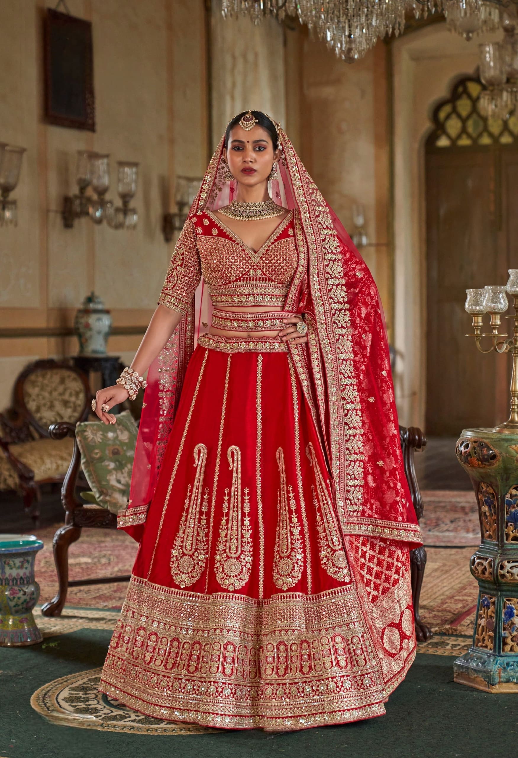 Red silk bridal lehenga with zari embroidery