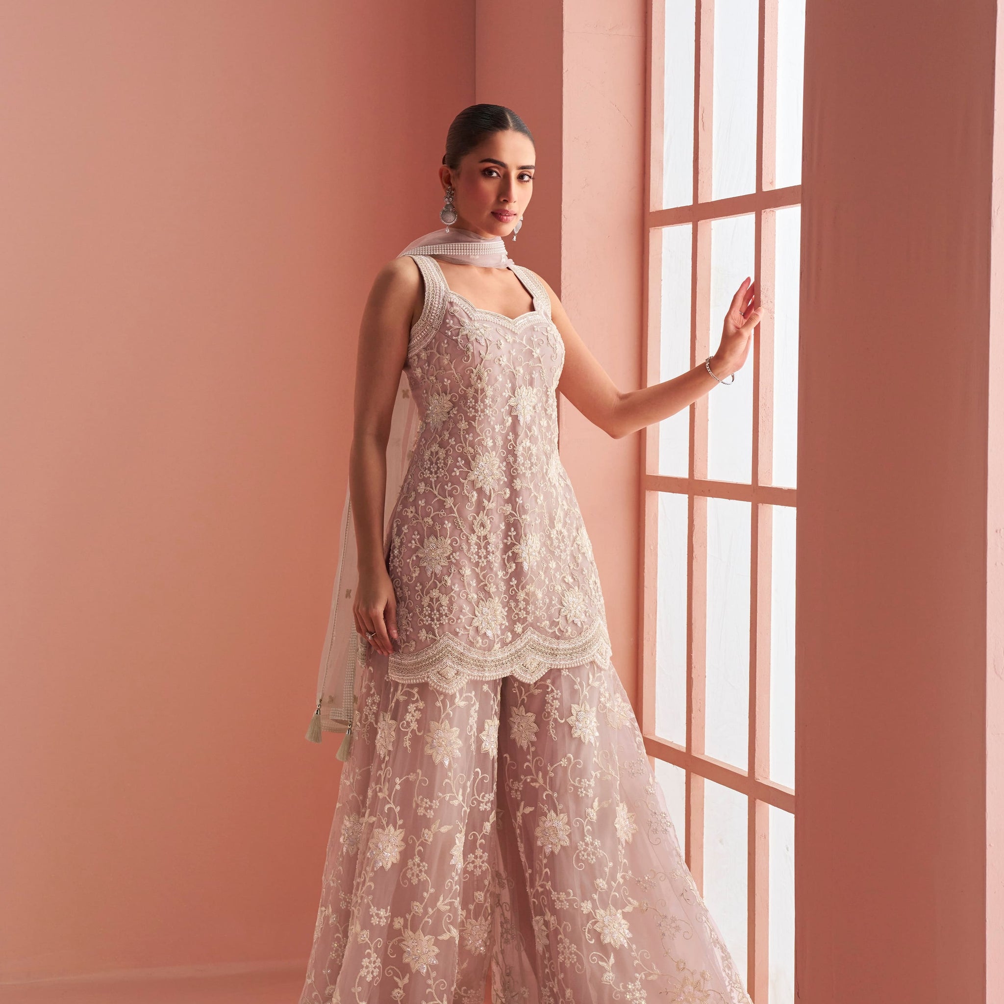 Dusty pink net embroidered sharara suit with halter neck