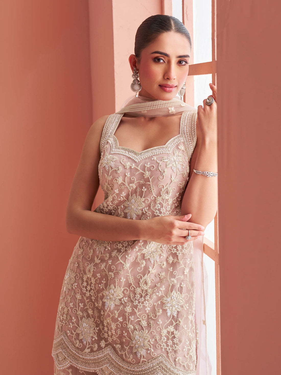 Dusty pink net embroidered sharara suit with halter neck