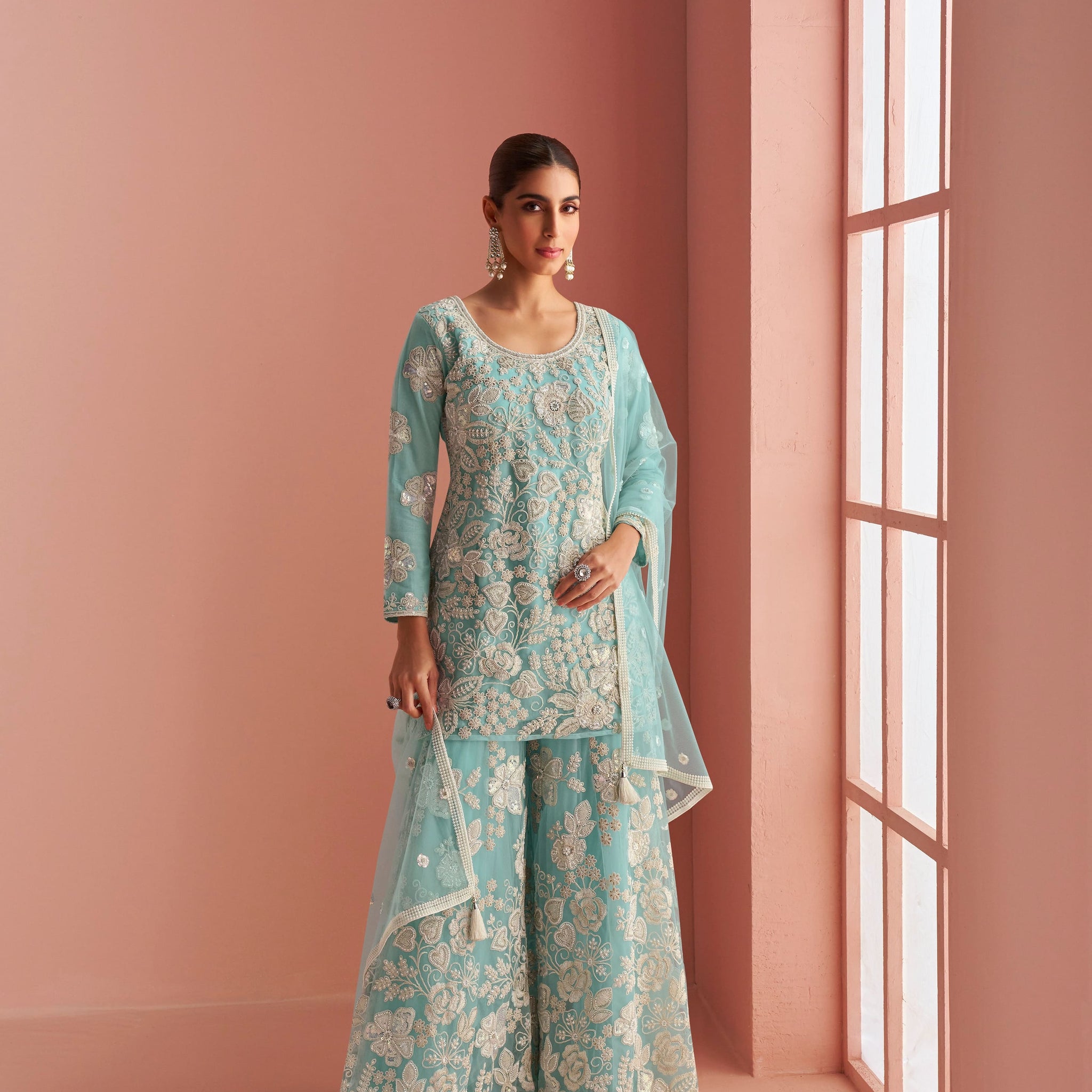 Aqua blue embroidered net sharara suit with dupatta